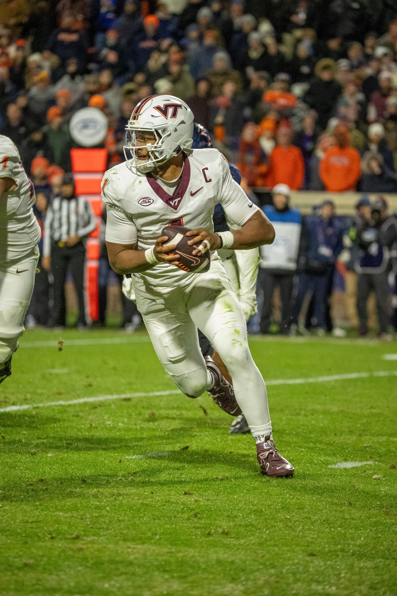 Virginia Tech QB Kyron Drones Scrambles around in the pocket looking for an open receiver