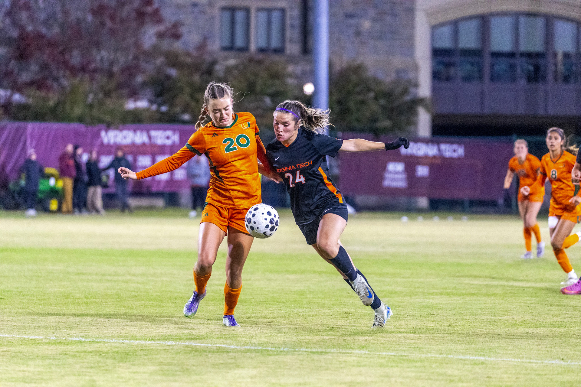Virginia Tech forward Natalie Mitchell (24) battles for possession of the ball