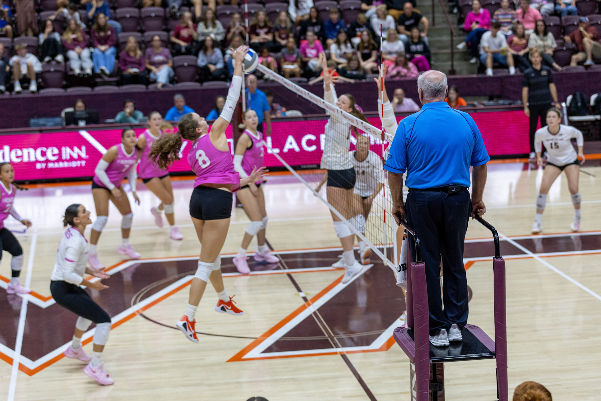 Outside hitter Adeline Hundl (8) rises up for the kill