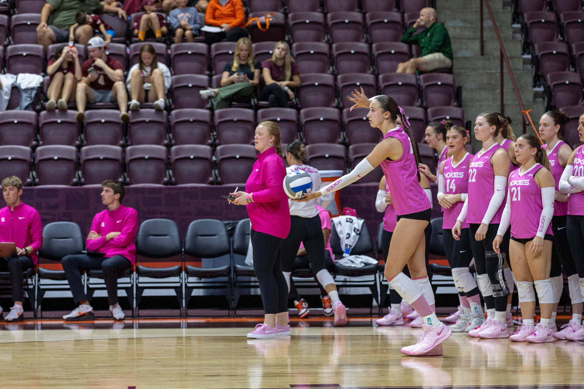 Middle blocker Isabella Mishler (4) prepares to serve the ball