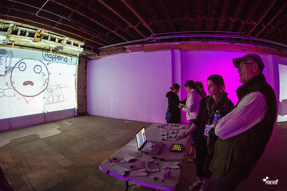 Demonstrating the interactive component of 'Flipbook (re)Cycle' (Photo: Jason Poncheri)