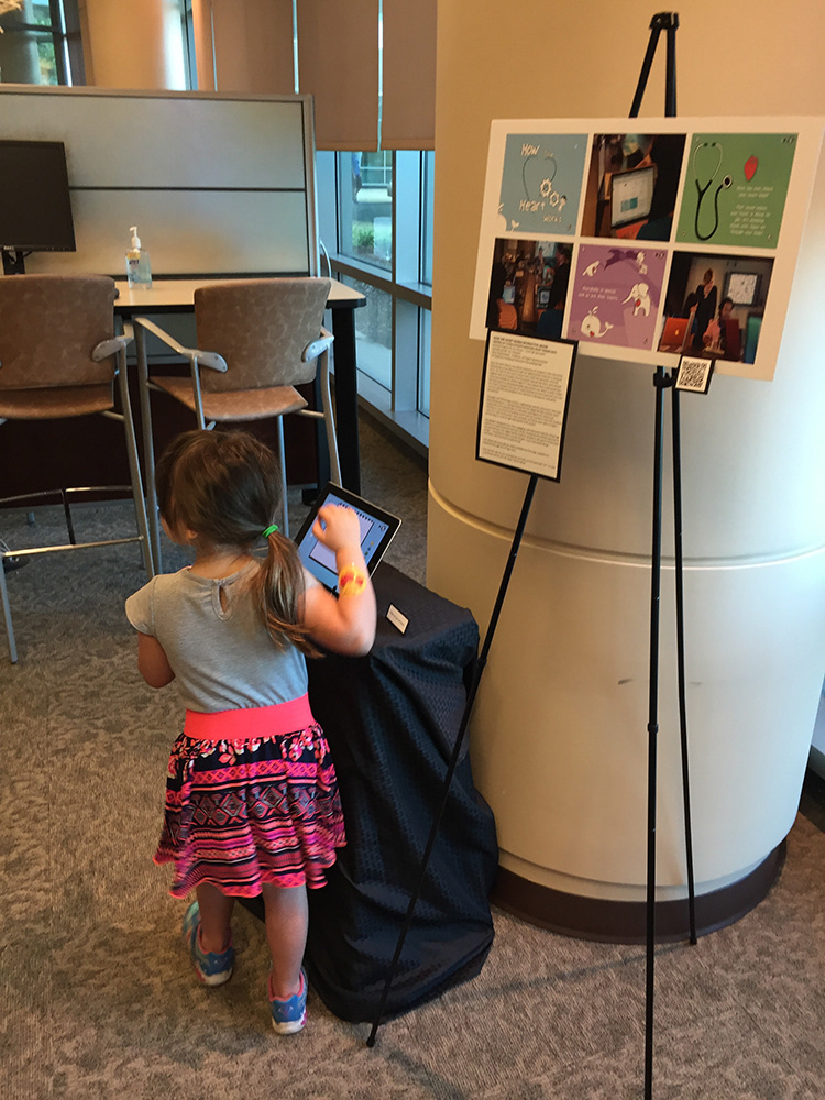 Children playing with the eBook during an artshow at Shands Children's Hospital.