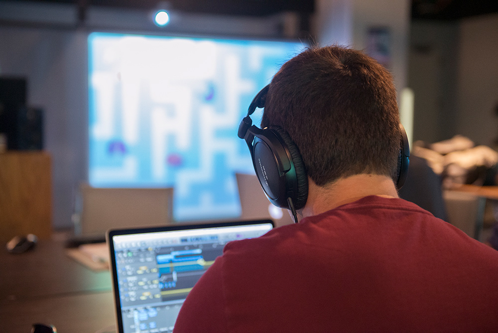 Student, Ethan Tripp, working on music for the eBook.