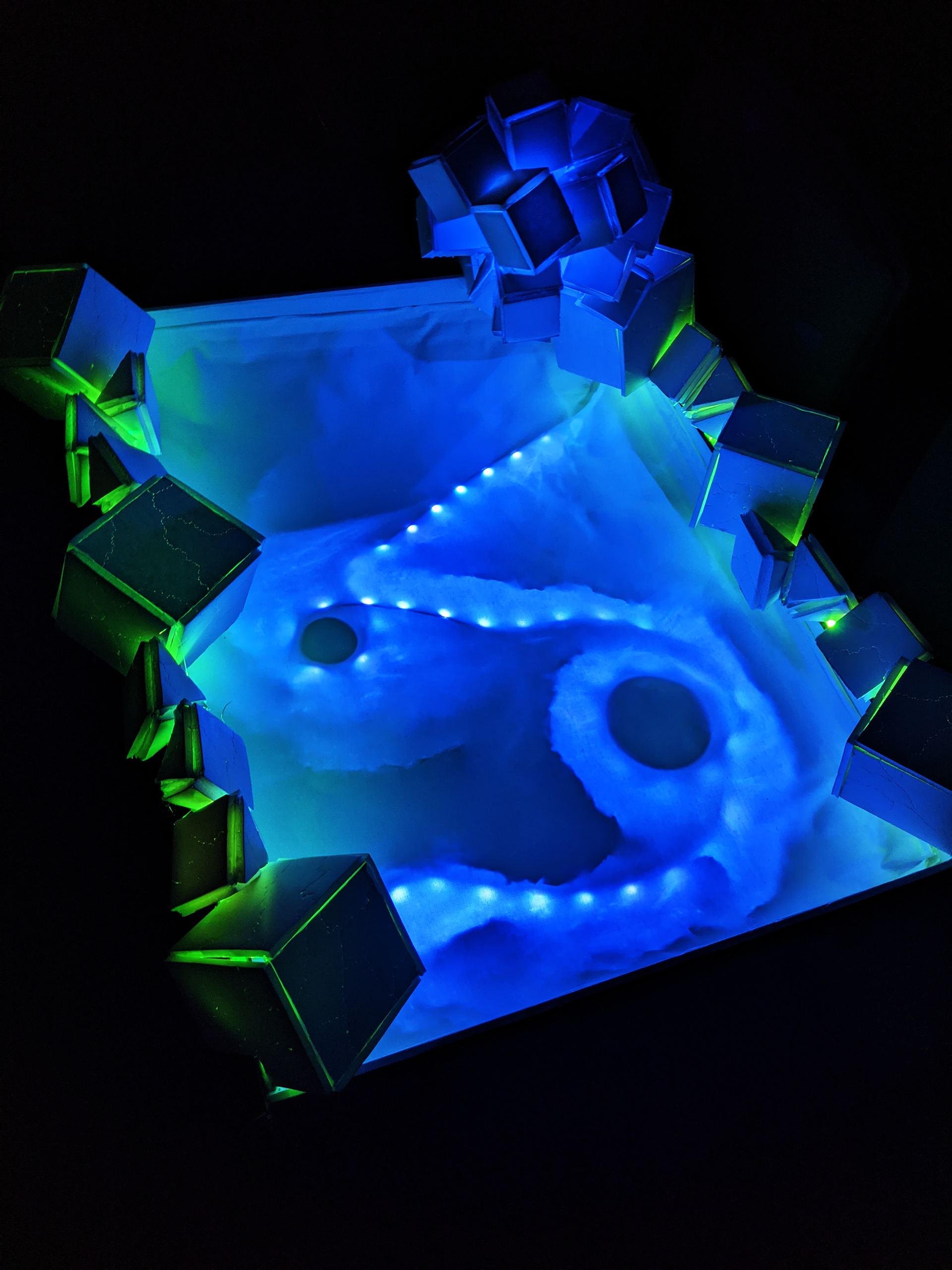 Cosmic Radiation Composing with Light Sculpture, 2023, Foam Board/Exacto Knife/Hot Glue/Aluminum Foil/Tape/2 LED Light Strips, 32"x24" in.