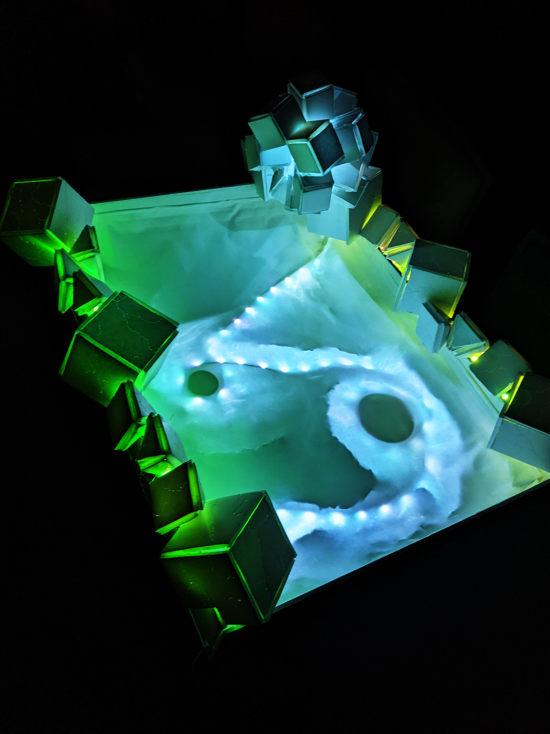 Cosmic Radiation Composing with Light Sculpture, 2023, Foam Board/Exacto Knife/Hot Glue/Aluminum Foil/Tape/2 LED Light Strips, 32"x24" in.