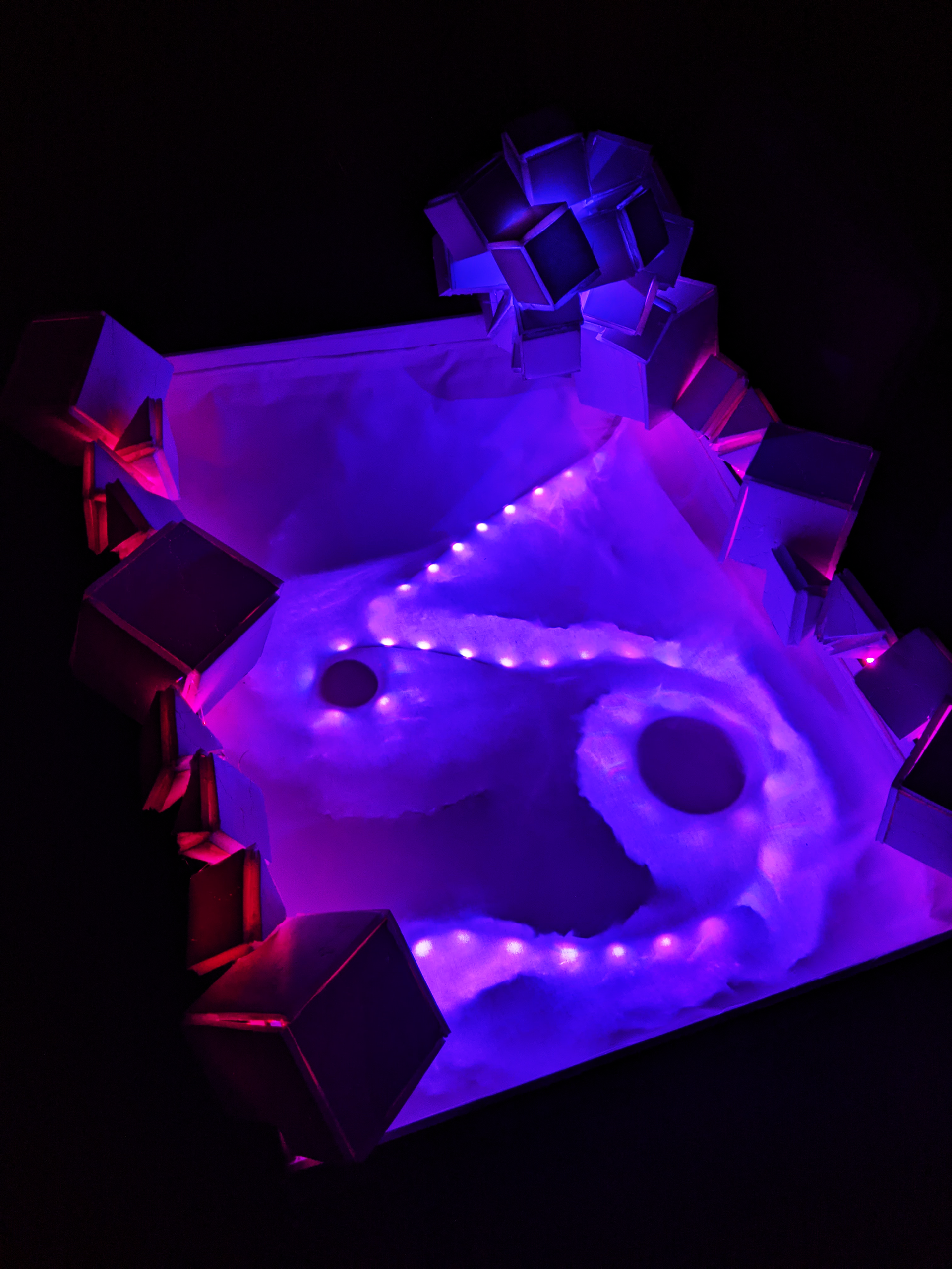 Cosmic Radiation Composing with Light Sculpture, 2023, Foam Board/Exacto Knife/Hot Glue/Aluminum Foil/Tape/2 LED Light Strips, 32"x24" in.