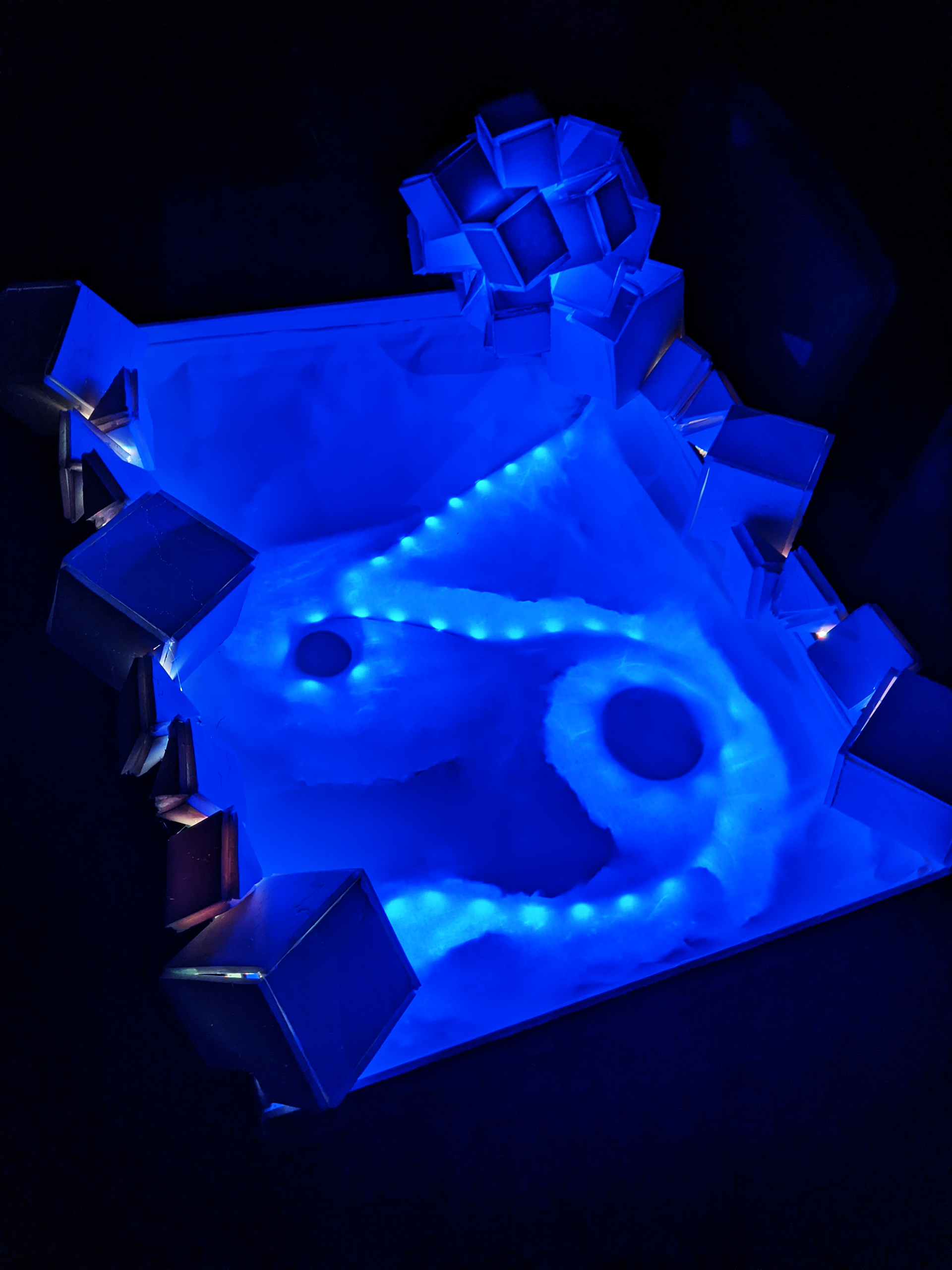 Cosmic Radiation Composing with Light Sculpture, 2023, Foam Board/Exacto Knife/Hot Glue/Aluminum Foil/Tape/2 LED Light Strips, 32"x24" in.