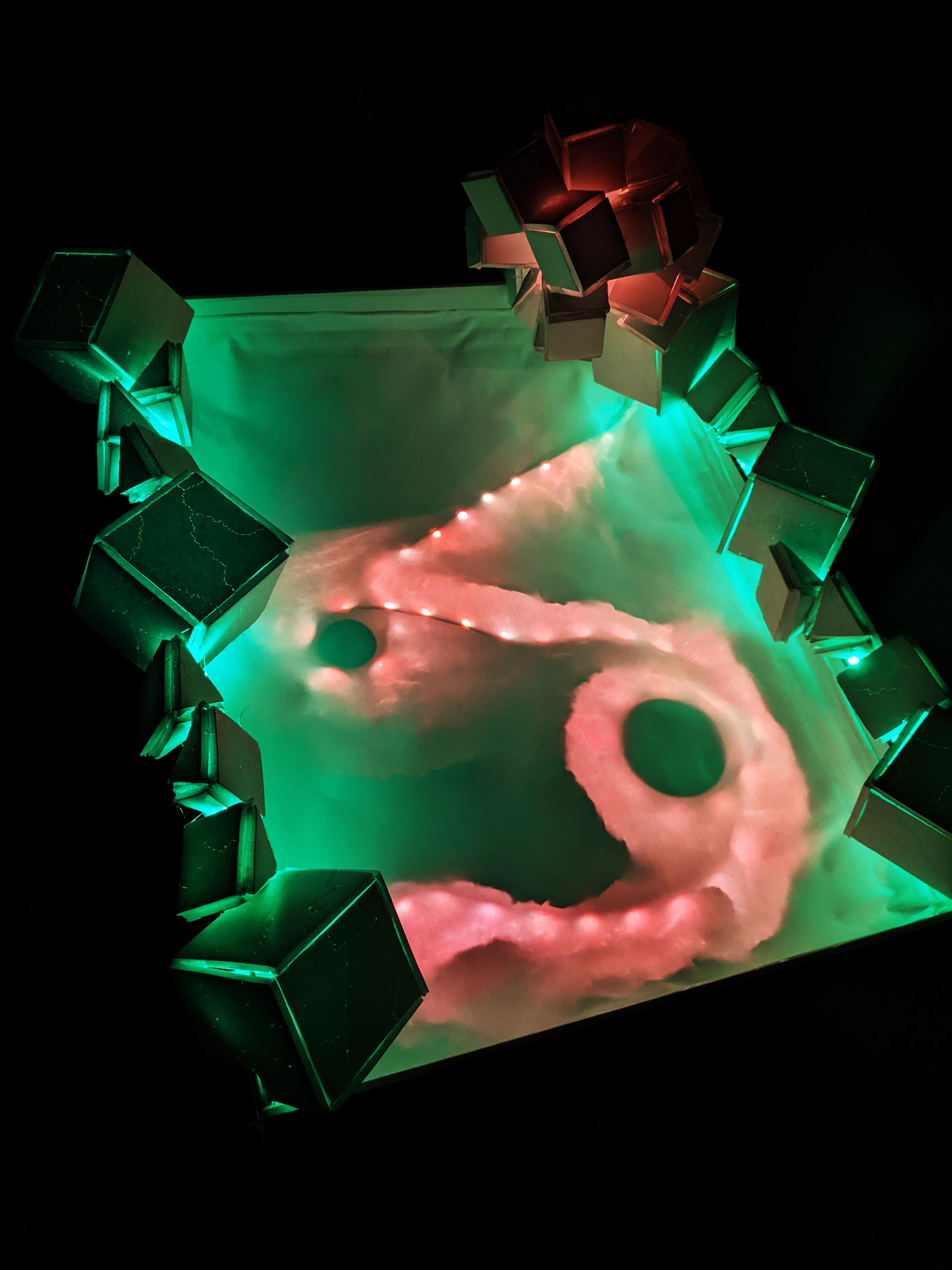 Cosmic Radiation Composing with Light Sculpture, 2023, Foam Board/Exacto Knife/Hot Glue/Aluminum Foil/Tape/2 LED Light Strips, 32"x24" in.
