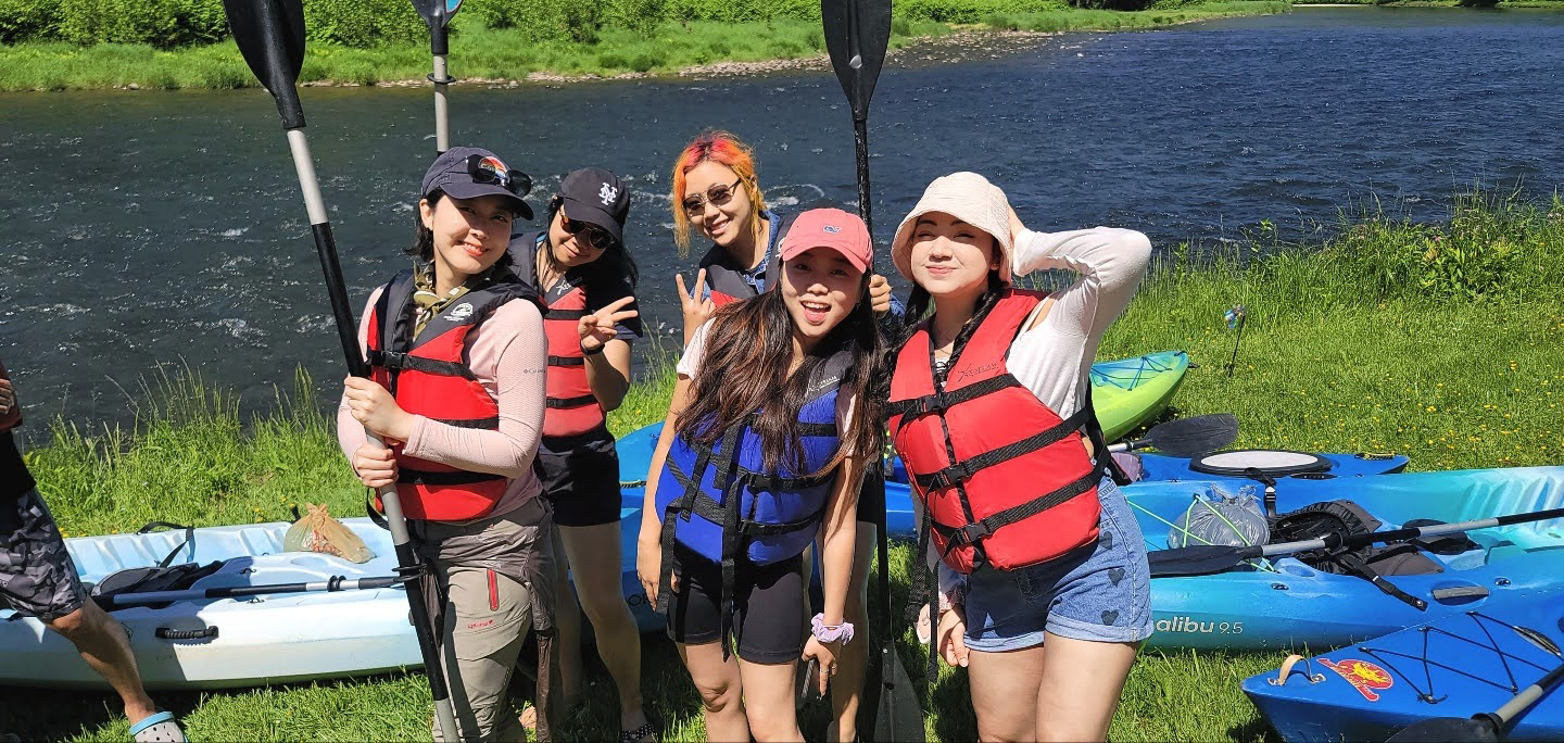 Katie and friends before a kayaking trip, 2021.