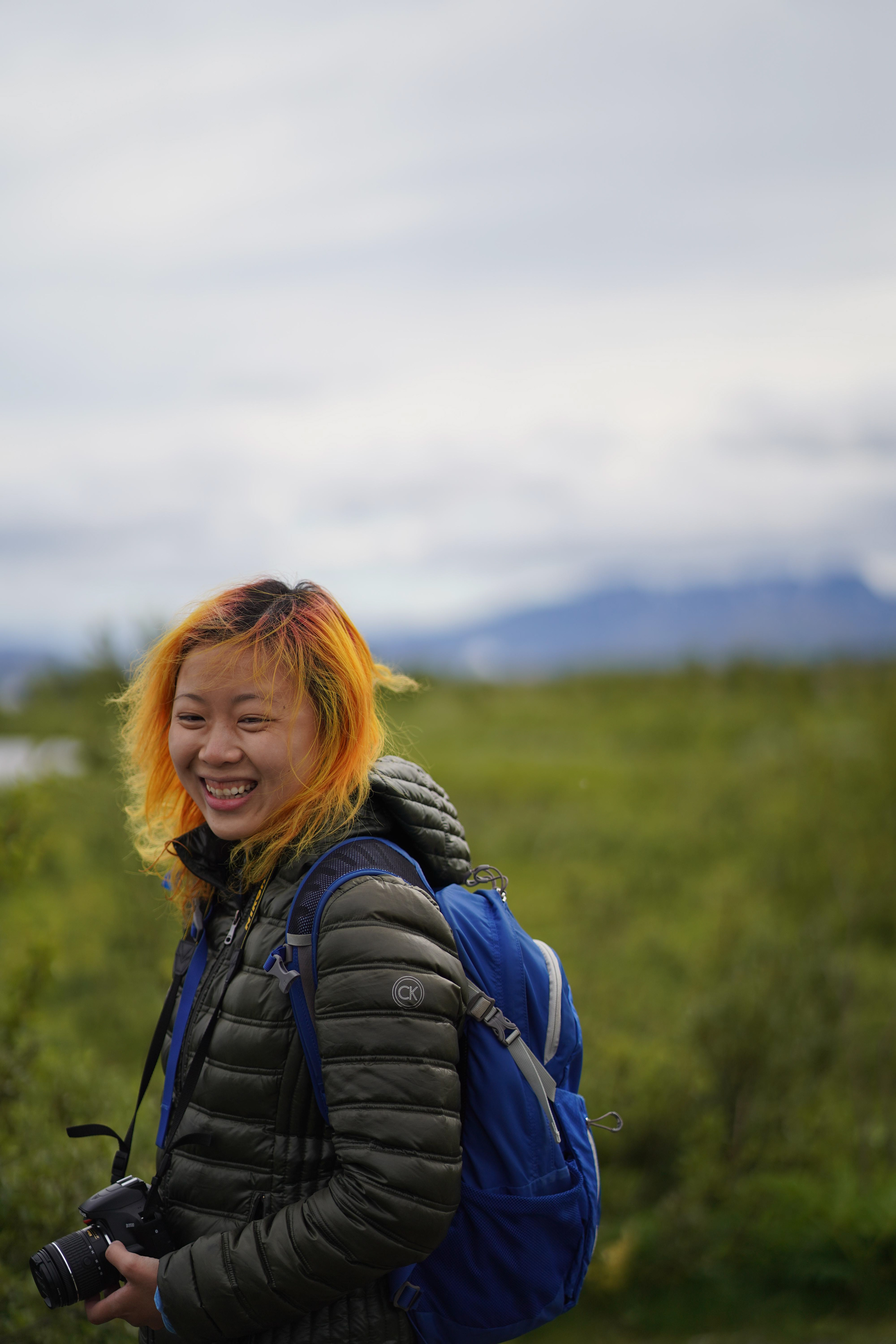 This is Katie! Smiling with a camera in Iceland.