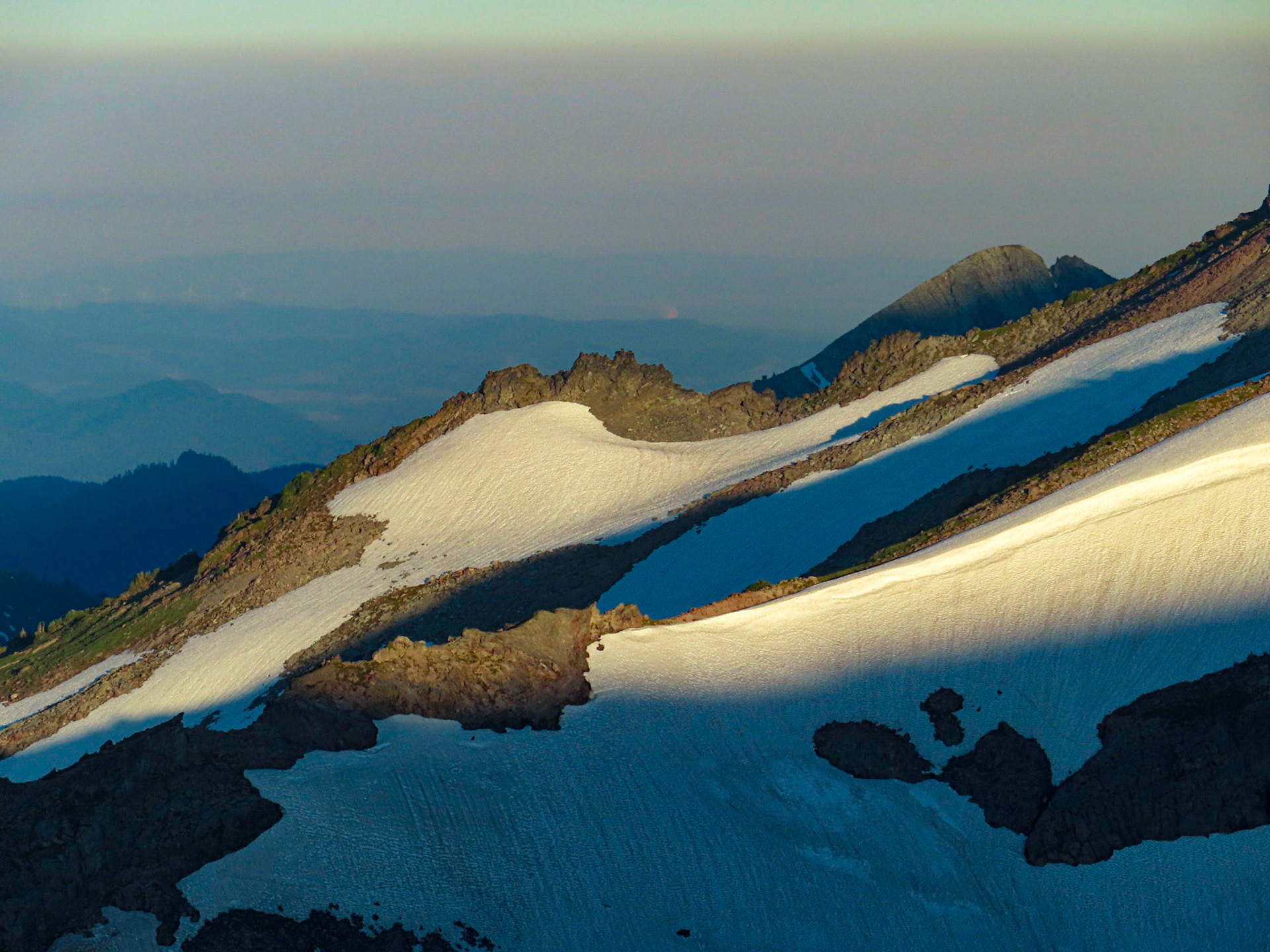 Early morning sunlight illuminates the cleaver saparating lower Nisqually Glacier from Wilson Glacier, on Mt Rainier.