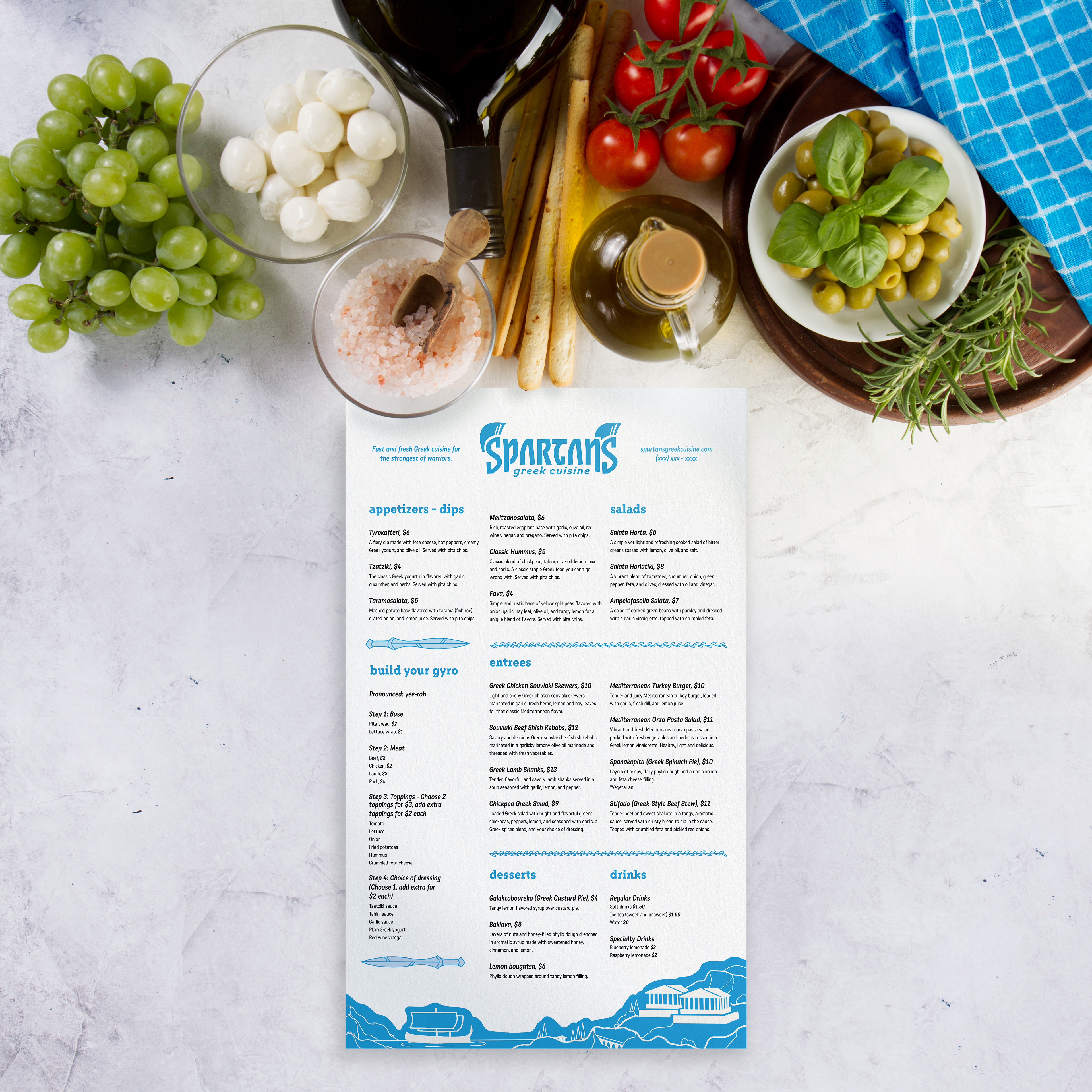 Menu on a marble tabletop with food.
