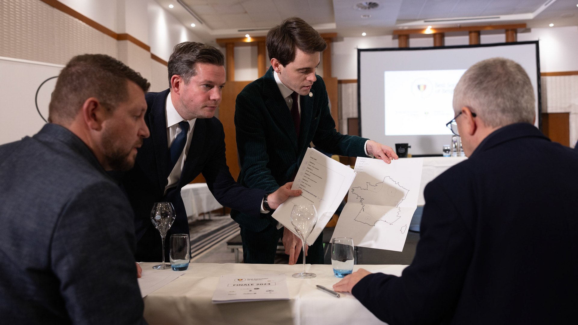 20231112 ANTWERP, BELGIUM Radisson Blu Astrid Hotel, final Best Sommelier of Belgium. Three candidates emerged from a pool of 14 in the semi-final, and the finalist is yet to be (-)After six practical tests that assessed participants' extensive knowledge, craftsmanship, and ability to handle stress, it was revealed that ……….. emerged as the ultimate winner. Employed at restaurant …………, ……….. will proudly carry the title not just for this year but throughout his entire professional career, as the title is a one-time achievement. The annual competition is organized by the Belgian Sommeliers Guild, with a distinguished jury comprising influential figures from the wine industry, past winners, and international members. This official title, unlike various commercial initiatives, not only comes with a trophy, valuable prizes, and enduring recognition but also opens doors for the winner to compete in European and World Championships. These global competitions are organized by ASI (Association Sommeliers International), currently led by the Belgian William Wouters.