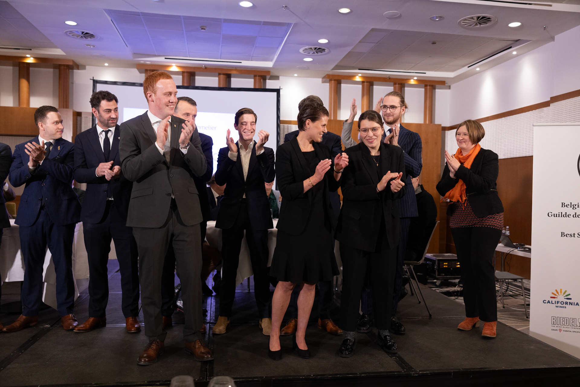 20231112 ANTWERP, BELGIUM Radisson Blu Astrid Hotel, final Best Sommelier of Belgium. Three candidates emerged from a pool of 14 in the semi-final, and the finalist is yet to be (-)After six practical tests that assessed participants' extensive knowledge, craftsmanship, and ability to handle stress, it was revealed that ……….. emerged as the ultimate winner. Employed at restaurant …………, ……….. will proudly carry the title not just for this year but throughout his entire professional career, as the title is a one-time achievement. The annual competition is organized by the Belgian Sommeliers Guild, with a distinguished jury comprising influential figures from the wine industry, past winners, and international members. This official title, unlike various commercial initiatives, not only comes with a trophy, valuable prizes, and enduring recognition but also opens doors for the winner to compete in European and World Championships. These global competitions are organized by ASI (Association Sommeliers International), currently led by the Belgian William Wouters.