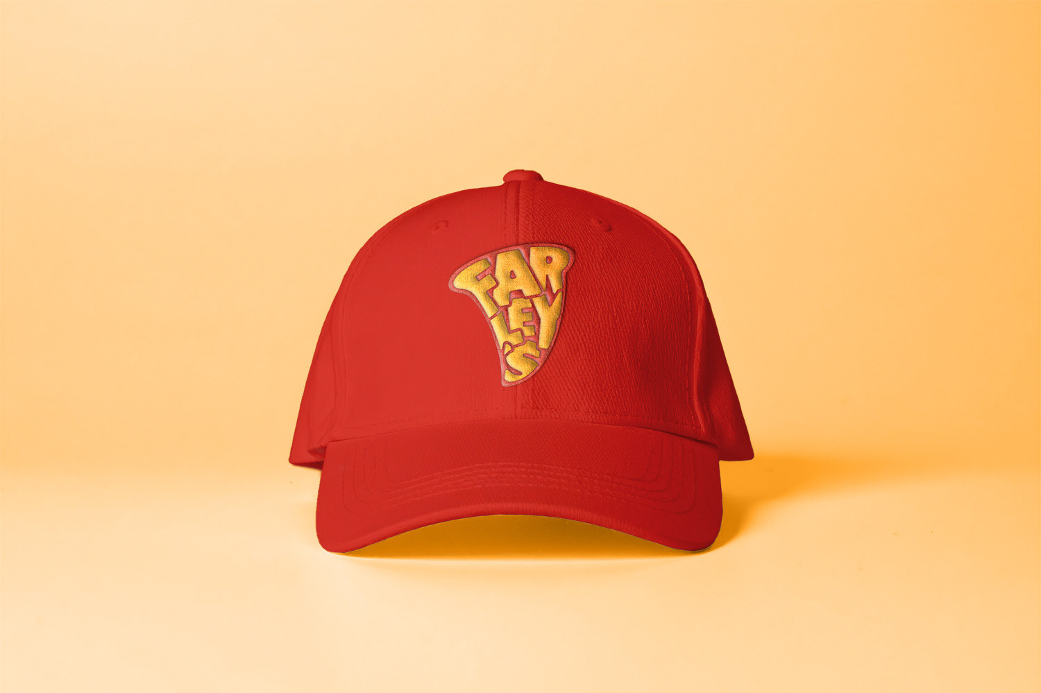 Farley's brandmark mockup on red hat.