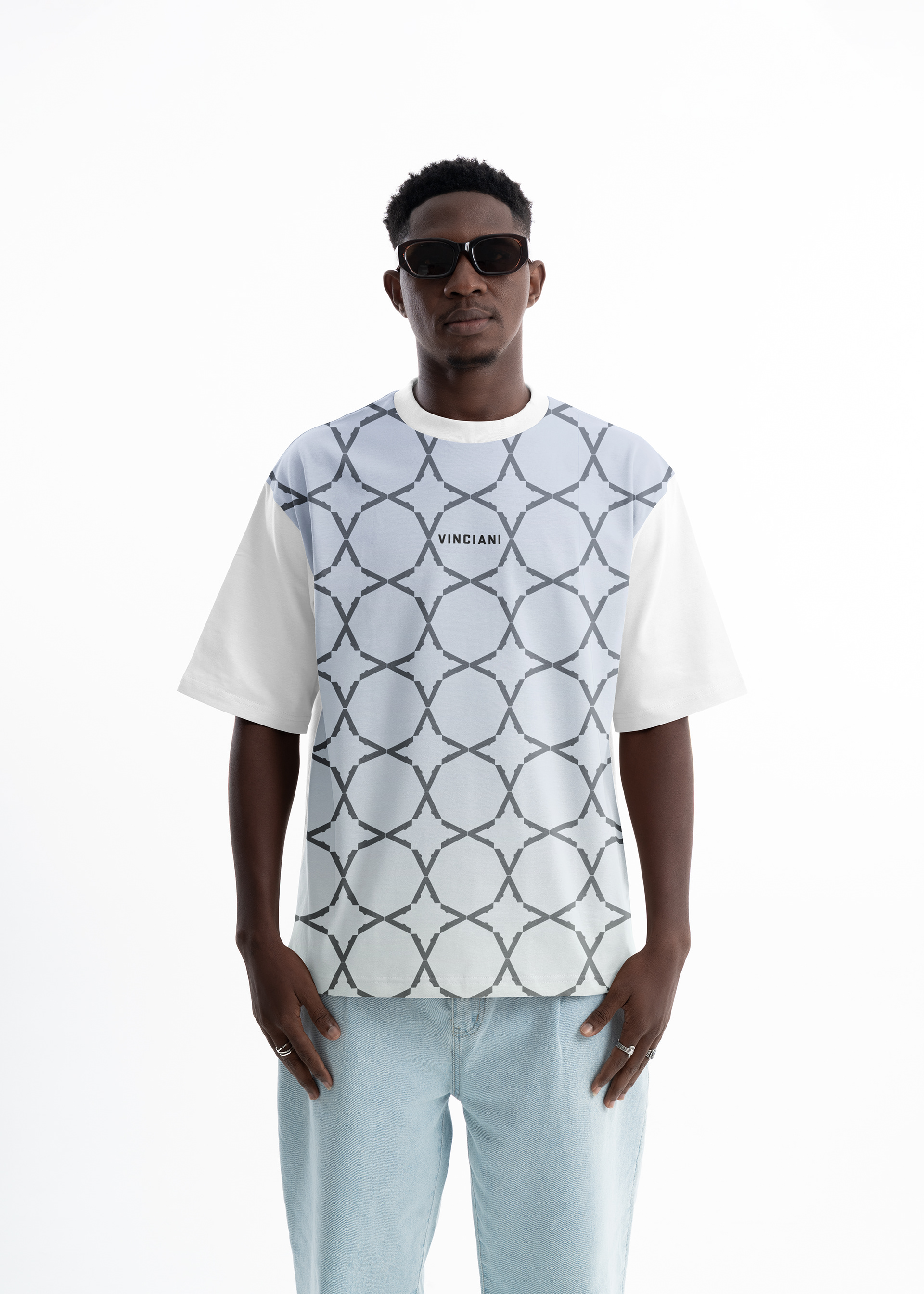 Vinciani ice blue oversized T-shirt featuring the signature House Pattern, grey geometric repeat design, white sleeves and centred Vinciani wordmark.