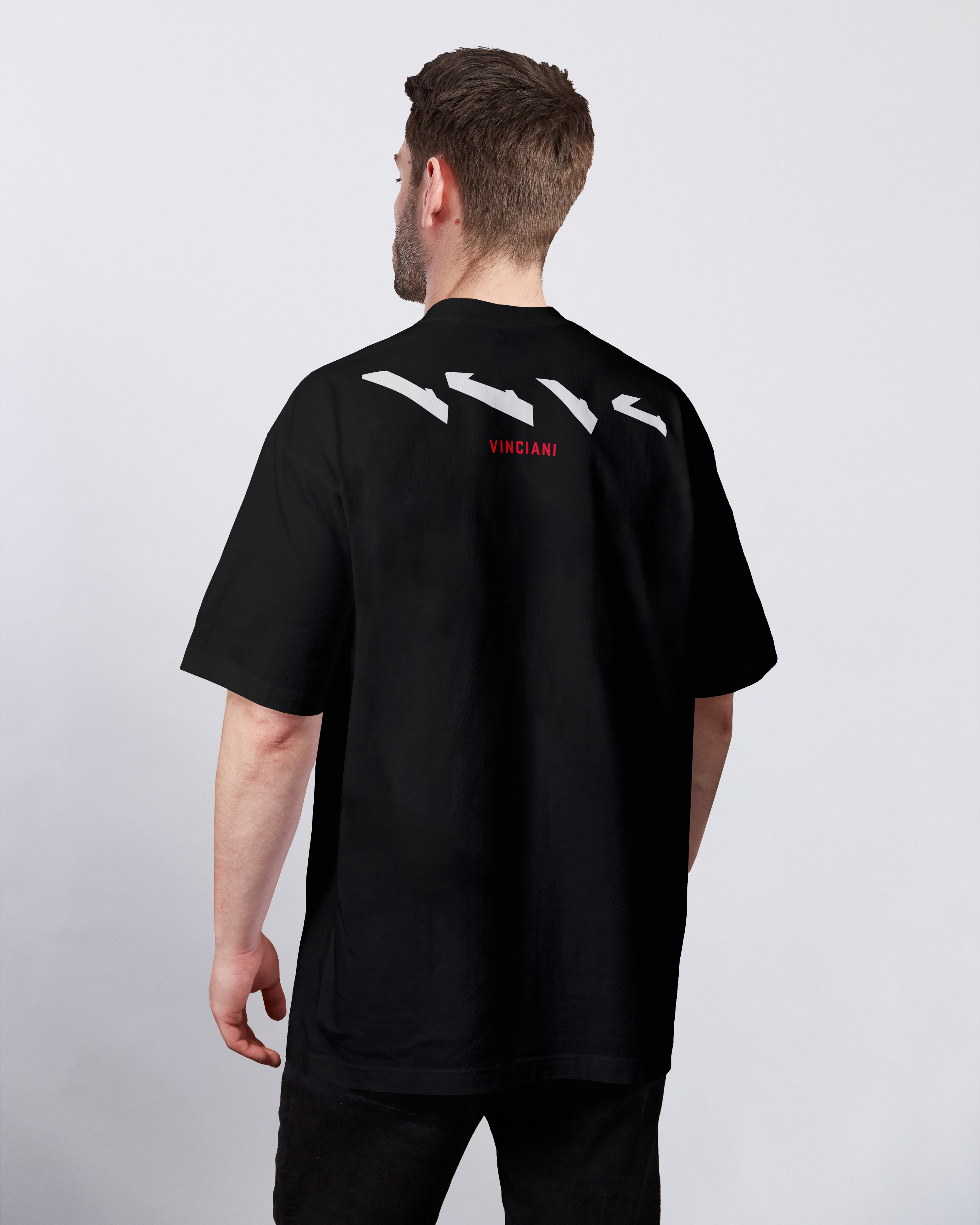 Vinciani oversized black T-shirt featuring the Discipline Stripe shoulder graphic and red Vinciani wordmark on the back.