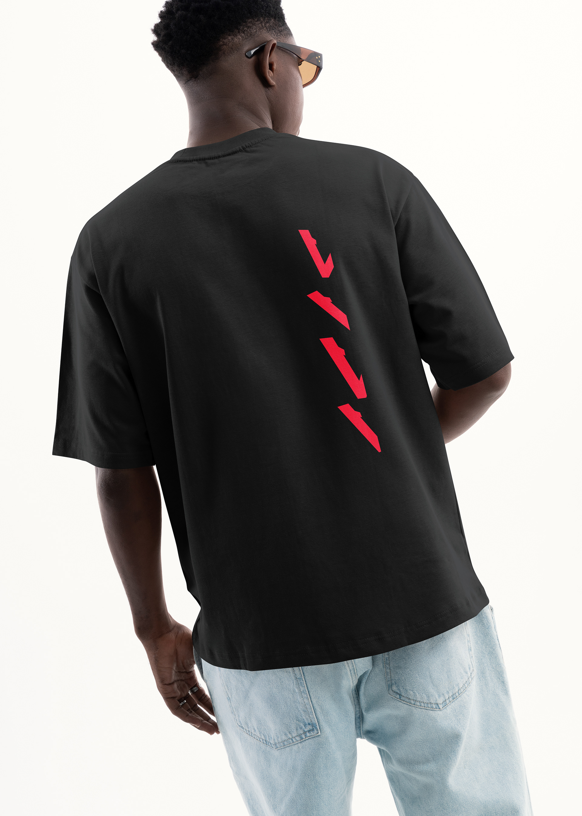 Black Vinciani oversized luxury streetwear t-shirt with red Momentum Stripe back graphic, inspired by the Vinciani V-Mark and signature geometric design language.