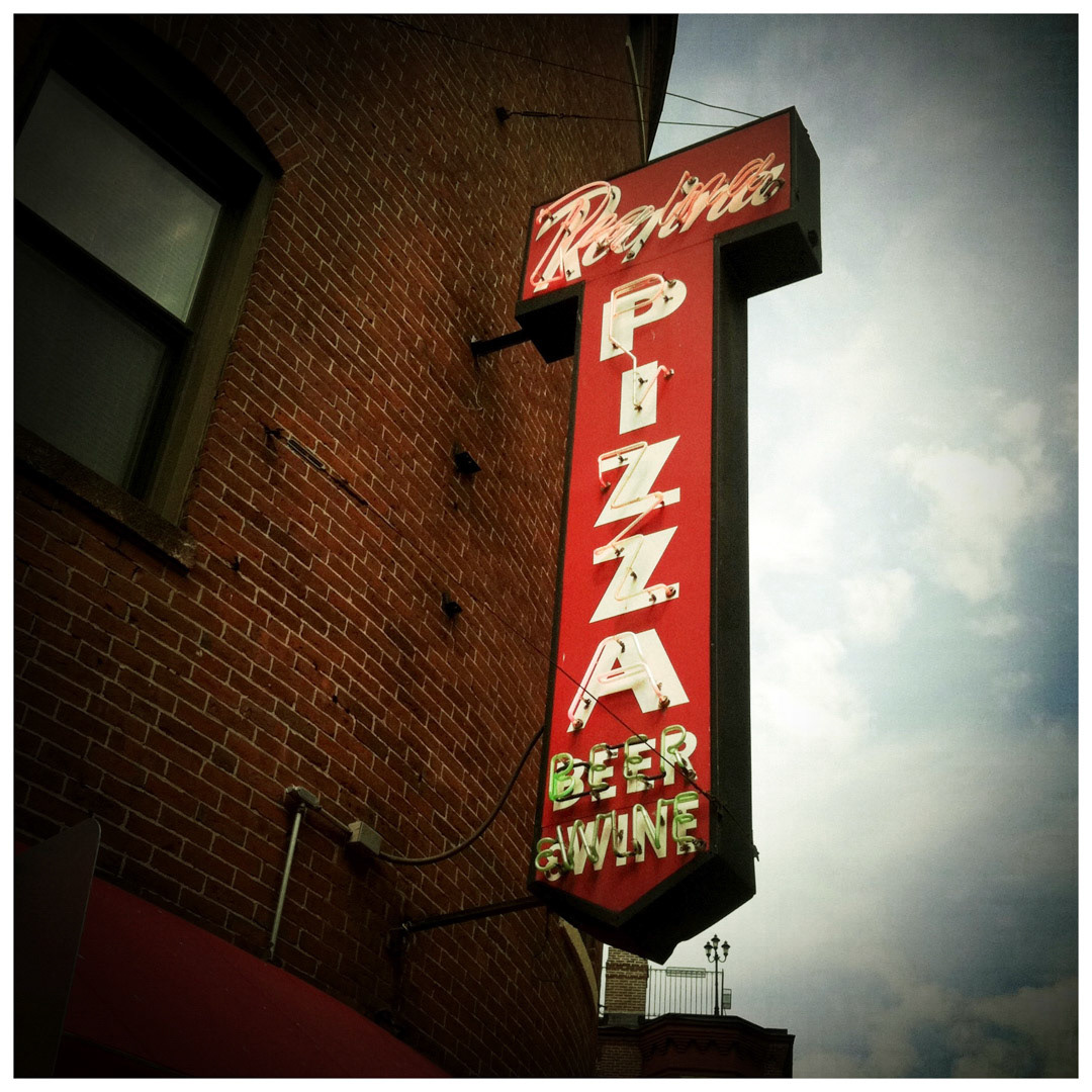 15. Pizzeria Regina Sign ••• Anyone who’s been to Pizzeria Regina know they serve slices of heaven, but they also have one of the coolest neon signs in Boston’s North End. Originally founded in 1926 by the Polcari family, Regina’s is is known for its awesome atmosphere and lines that stretch up the street on busy nights. (#15 of 100 in the Boston Signage Project)