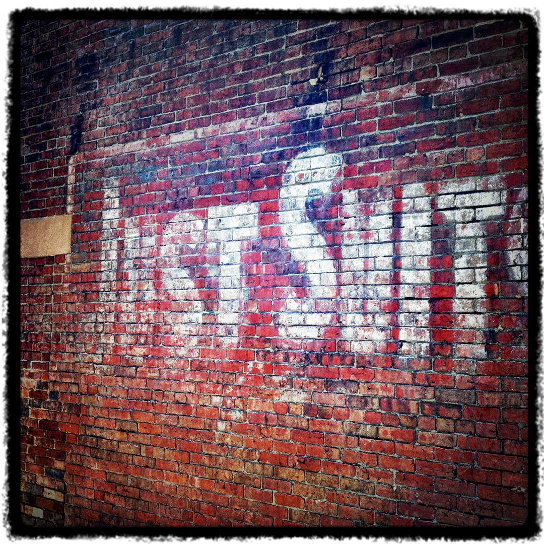 46. Just Suits Sign ••• Long ago you may have been able to get yourself a fancy suit here, but if you come to this small alley on North Street today, all you will find is some garbage cans and maybe a stray cat. (#46 of 100 in the Boston Signage Project) ••• 2023 Update: Sign was unfortunately destroyed to make room for a new ordinary sign for Riccardo's Ristorante.