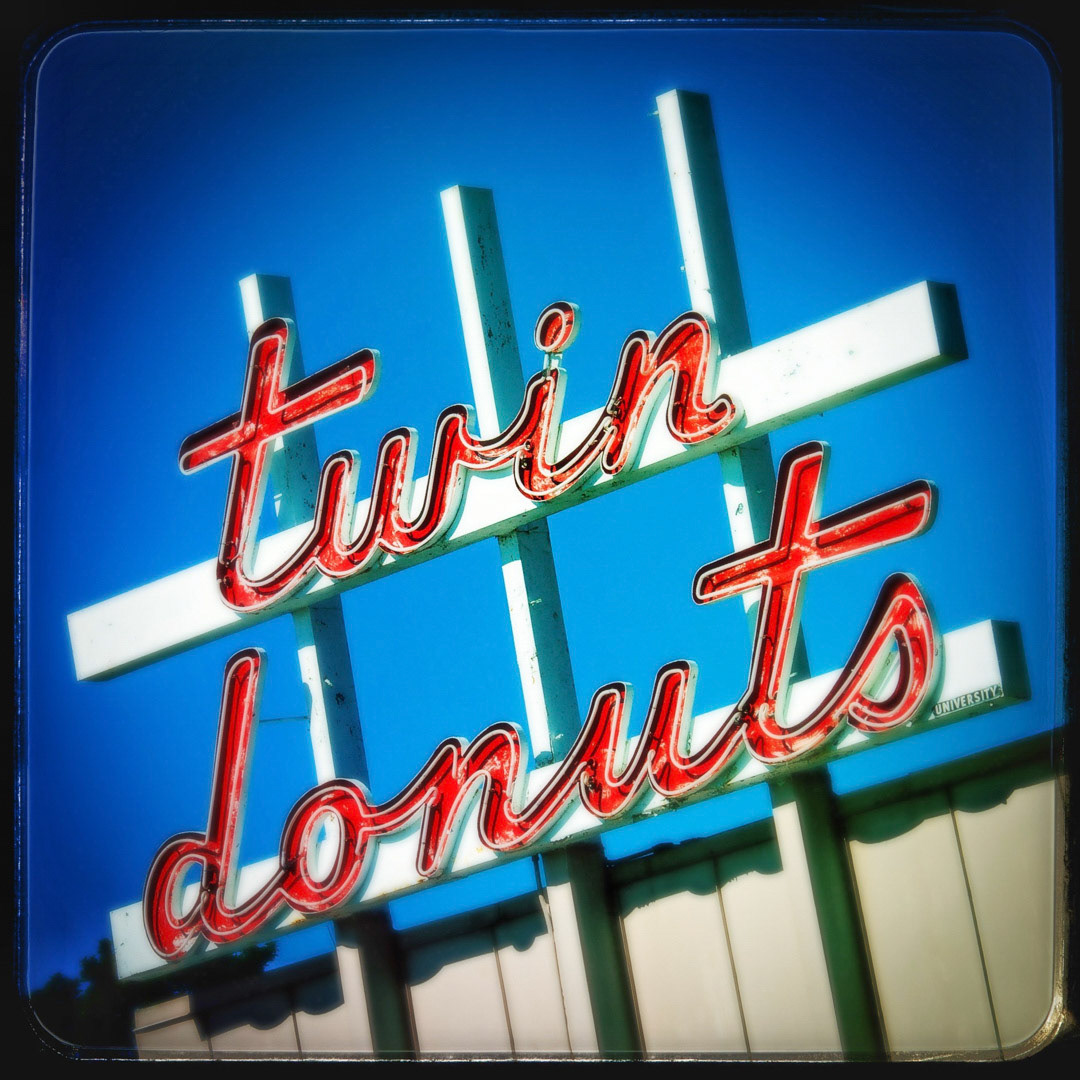 32. Twin Donuts Sign ••• When visiting this little shop in Union Square in Allston, you may feel like Marty McFly did after stepping out of his DeLorean. It was founded by George Psathas in 1959 and still has the old-school vibe, great breakfasts and cheap prices. Cool fact about George is that he used to work for Dunkin’ Donuts in the 50’s but left to develop Twin Donut, Inc. (#32 of 100 in the Boston Signage Project)