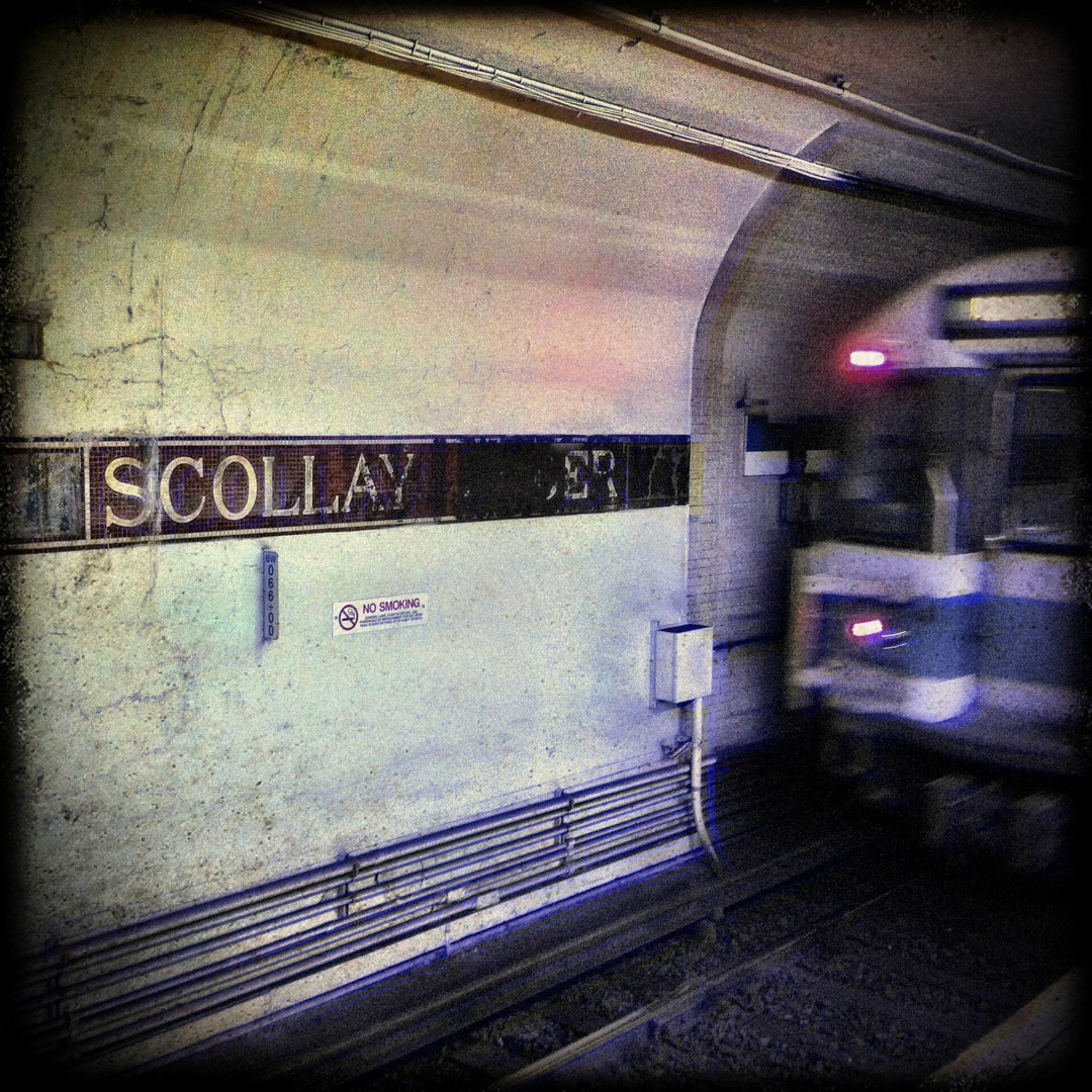 66. Scollay Under Sign ••• Before 1963, Government Center was known as Scollay Square and what is currently the Blue Line subway platform underground was once called Scollay Under. Recently some false walls were torn down, and the old Scollay Under mosaic tiles were uncovered, and can still be seen on the eastern portion of the platform. (#66 of 100 in the Boston Signage Project)