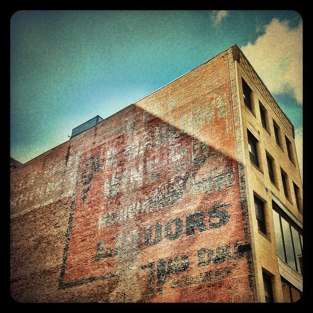 78. Old Marlowe Wine Co Ghost Sign ••• Painted during a time when doctors apparently treated diseases with alcohol, this impressive ghost sign on Friend Street reads "The Old Marlowe Wine Co. / Medicinally Pure / Liquors / Bald Eagle Whiskey" (#78 of 100 in the Boston Signage Project)