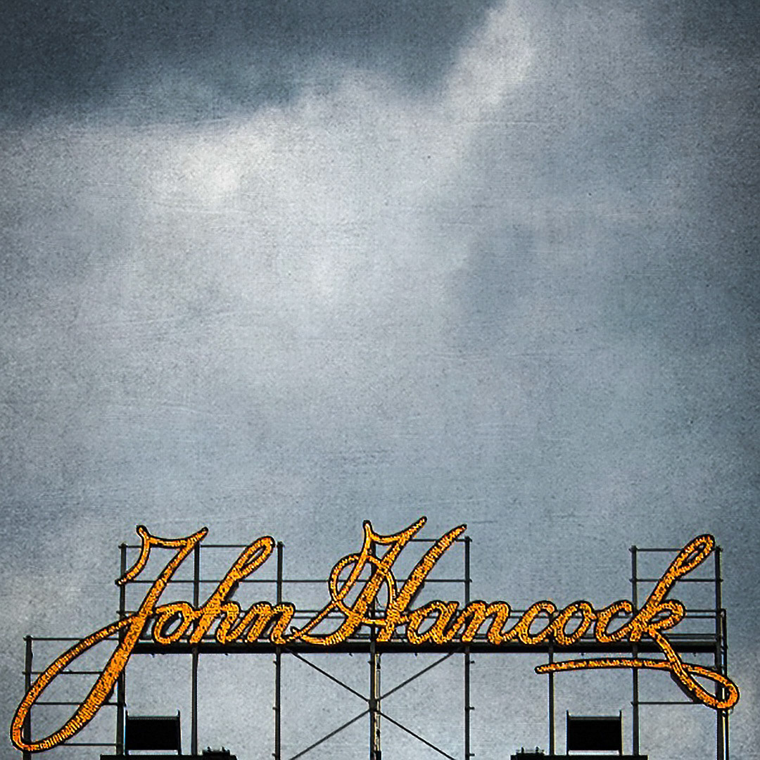 12. John Hancock Sign at Fenway Park ••• One of my favorite signs at Fenway is the Hancock signature, which sits high above the center field scoreboard. It was installed by the Red Sox in 2001 and stands 24-feet tall. When a Sox player hits a homerun, the LED bulbs flicker in Vegas-like fashion. (#12 of 100 in the Boston Signage Project)