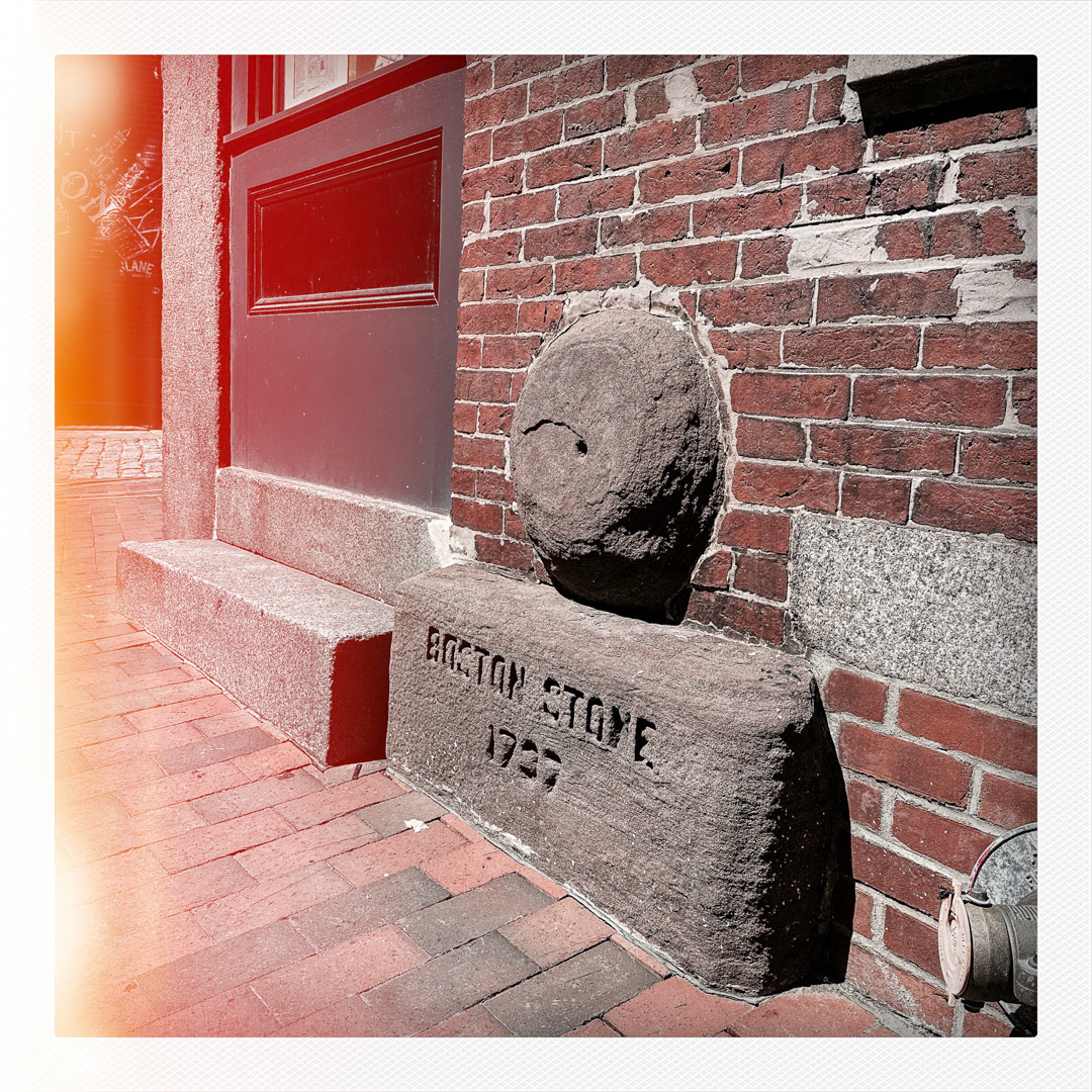 2. Boston Stone Sign ••• Embedded in a brick building among the cobblestoned streets of the Blackstone Block Historic District is this 2-foot stone with date of 1737. No one really knows the true significance of the minor landmark, but a popular theory is that it was imported from England by painter Thomas Childs and he used it to grind pigments for his paints. (#2 of 100 in the Boston Signage Project)