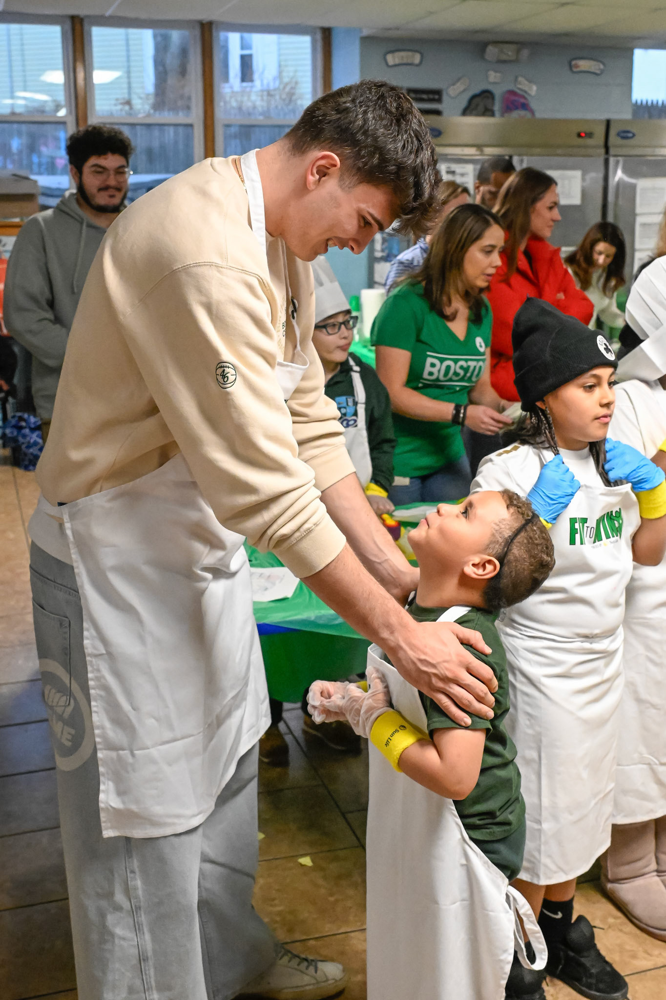 BOSTON, MA - MARCH 5, 2026: Boston Celtics players Derrick White, Hugo Gonzalez and Amari Williams visit youth at a Sun Life Fit to Win nutrition health event at East Boston YMCA . (Photo by Keith Sliney).