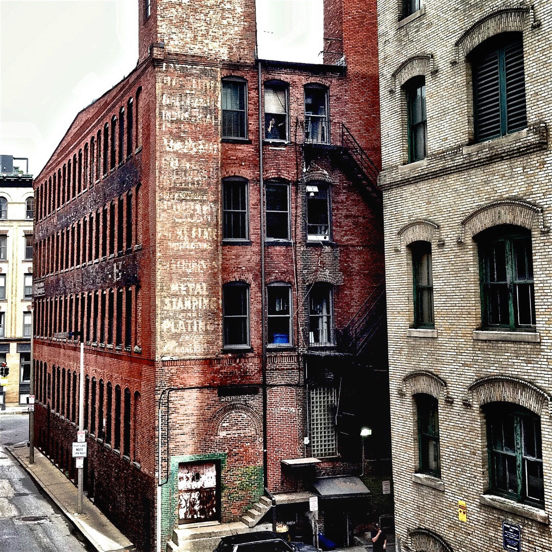95. Metal Stamping and Plating Sign ••• On Congress Street in the Fort Point area of the Seaport District stands this vintage brick building. Currently it is home to Lucky's Lounge, a hidden speak-easy club known for its retro feel and Sinatra-style live music. On the back of the building visible from Summer Street is this vertical ghost sign, most of which is illegible except for "Metal Stamping and Plating." (#95 of 100 in the Boston Signage Project)