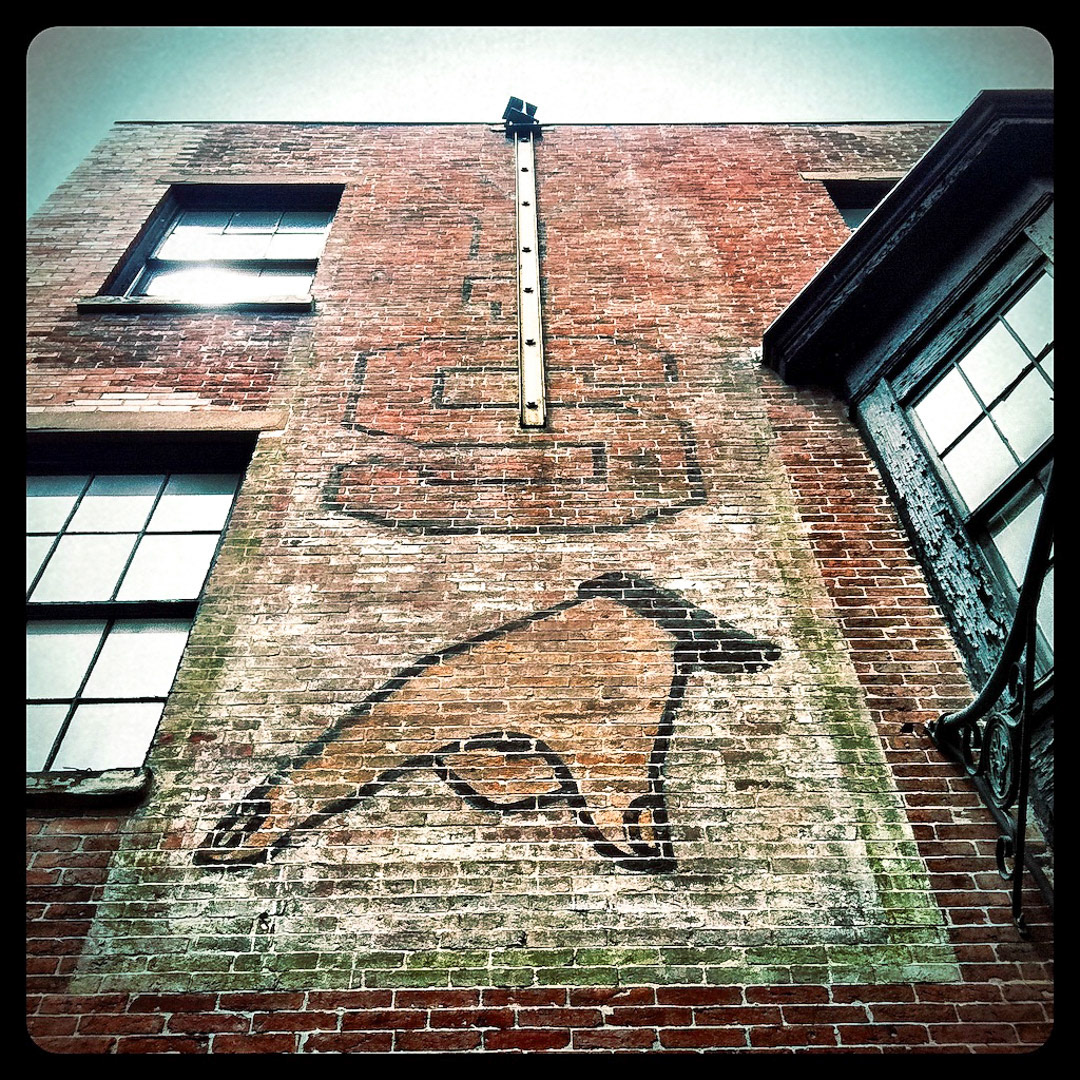 31. Ys Ghost Sign ••• If you walk along the cobblestone surface of the historic Blackstone Block on Marshall Street, you’ll come across this fading ghost sign. Pointing to a door that has been locked for years, the sign spells “Y’S”, which suggests that the top floors of this building were removed at some point after the sign was painted. (#31 of 100 in the Boston Signage Project)