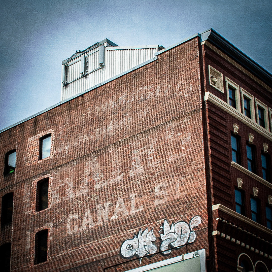 13. Allen Thompson Whitney Co Sign ••• This century-old sign is located on Canal Street, one block away from the TD Garden. The original text displayed “Allen, Thompson, Whitney Co, Manufacturers of Chairs, 112 Canal St.” in a great slab serif typeface. The company was formed in 1898 (formerly the Boston Chair Company) and had their sales offices located here. Currently the building is being used by Boston Beerworks. (#13 of 100 in the Boston Signage Project)