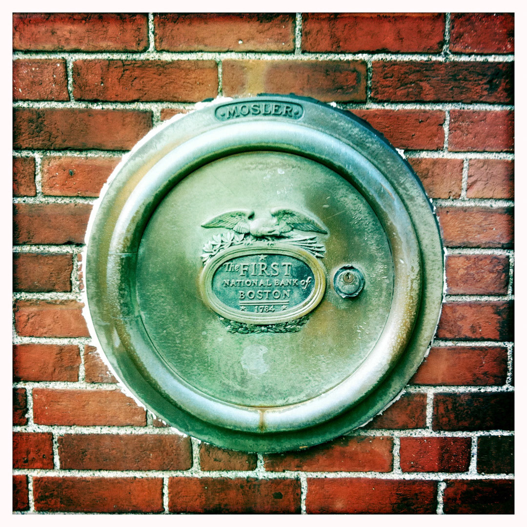 26. First National Bank of Boston Sign ••• Cool signs come in all shapes and sizes, and this old exterior bank vault door is about the size of a frisbee, located a couple of feet off the ground on Canal Street. The bank moved out but the sign remains (#26 of 100 in the Boston Signage Project)