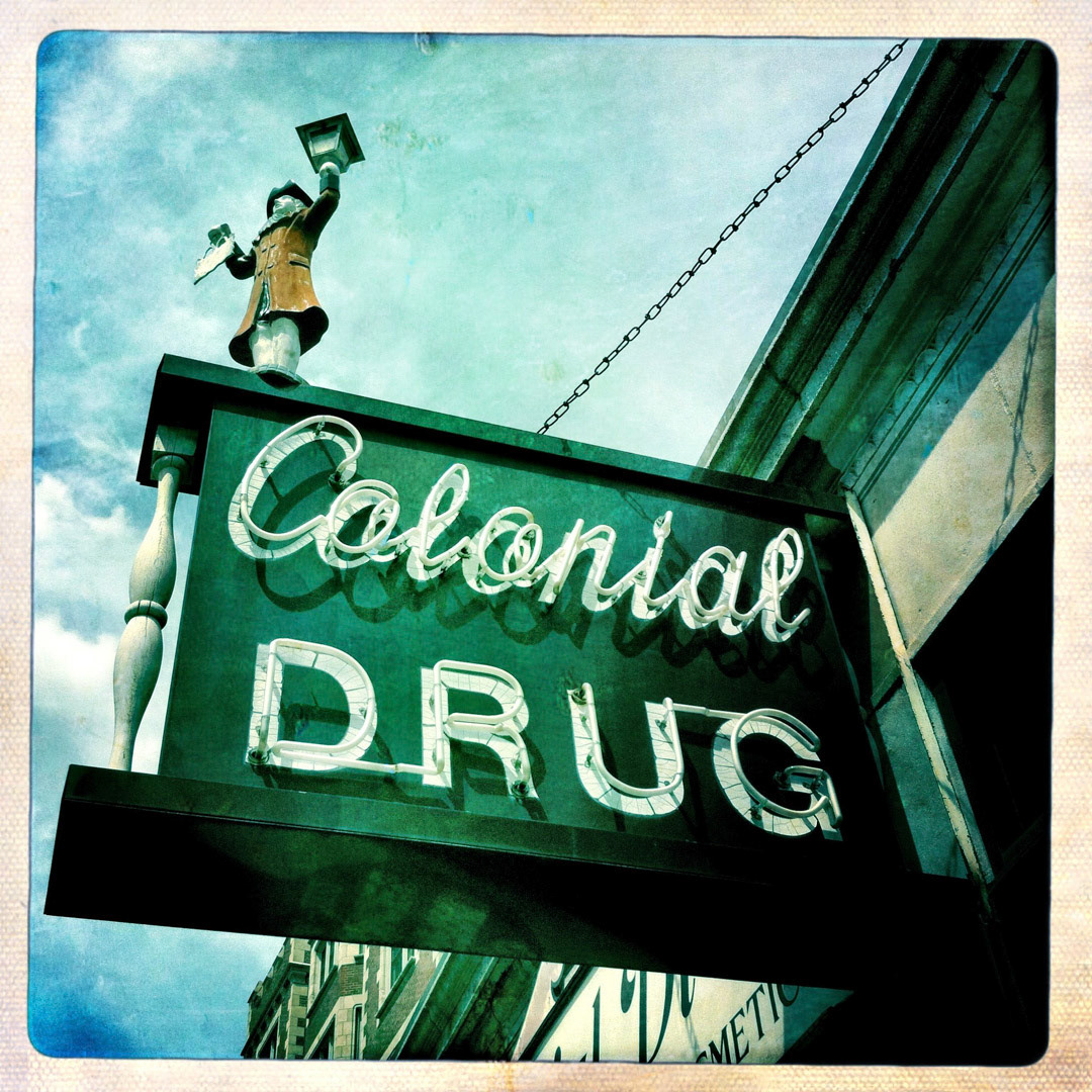 61. Colonial Drug Sign ••• Colonial Drug, established in 1947, is a family-owned old-fashioned drug store in Harvard Square and calls itself the "Hard-to-Find Fragrance Specialist".  (#61 of 100 in the Boston Signage Project) ••• 2023 Update: This location was closed down in 2013, moved to Newton, and sadly the sign did not make the journey.