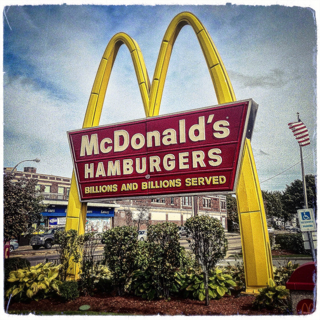91. McDonalds Double-Arch Sign ••• McDonald’s on Gallivan Boulevard in Dorchester still has the rare giant “M” sign that extends to the ground in front of the restaurant. Apparently it is one of only two McDonalds left in the state to have this double-arch style (the other is in North Hampton, MA). (#91 of 100 in the Boston Signage Project)