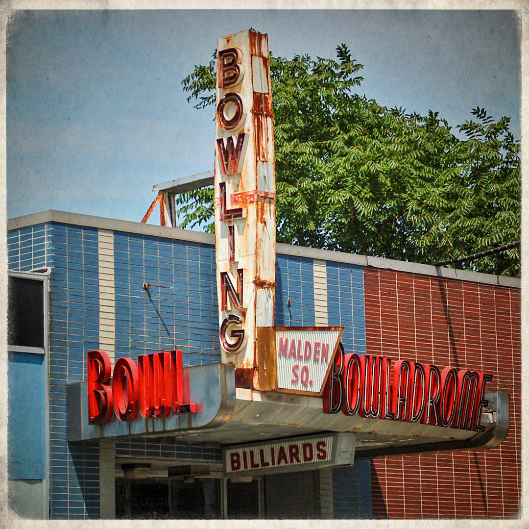 51. Malden Square Bowladrome Sign ••• Those who are still up for some old-school candlepin can head over to Charles Street in Malden for a few strings. Recently the place was bought and the name was changed to Ryan Family Amusements, but the new owners wisely kept these 50s-style signs intact. (#51 of 100 in the Boston Signage Project) ••• 2023 Update: Building was razed, status of sign is unknown.