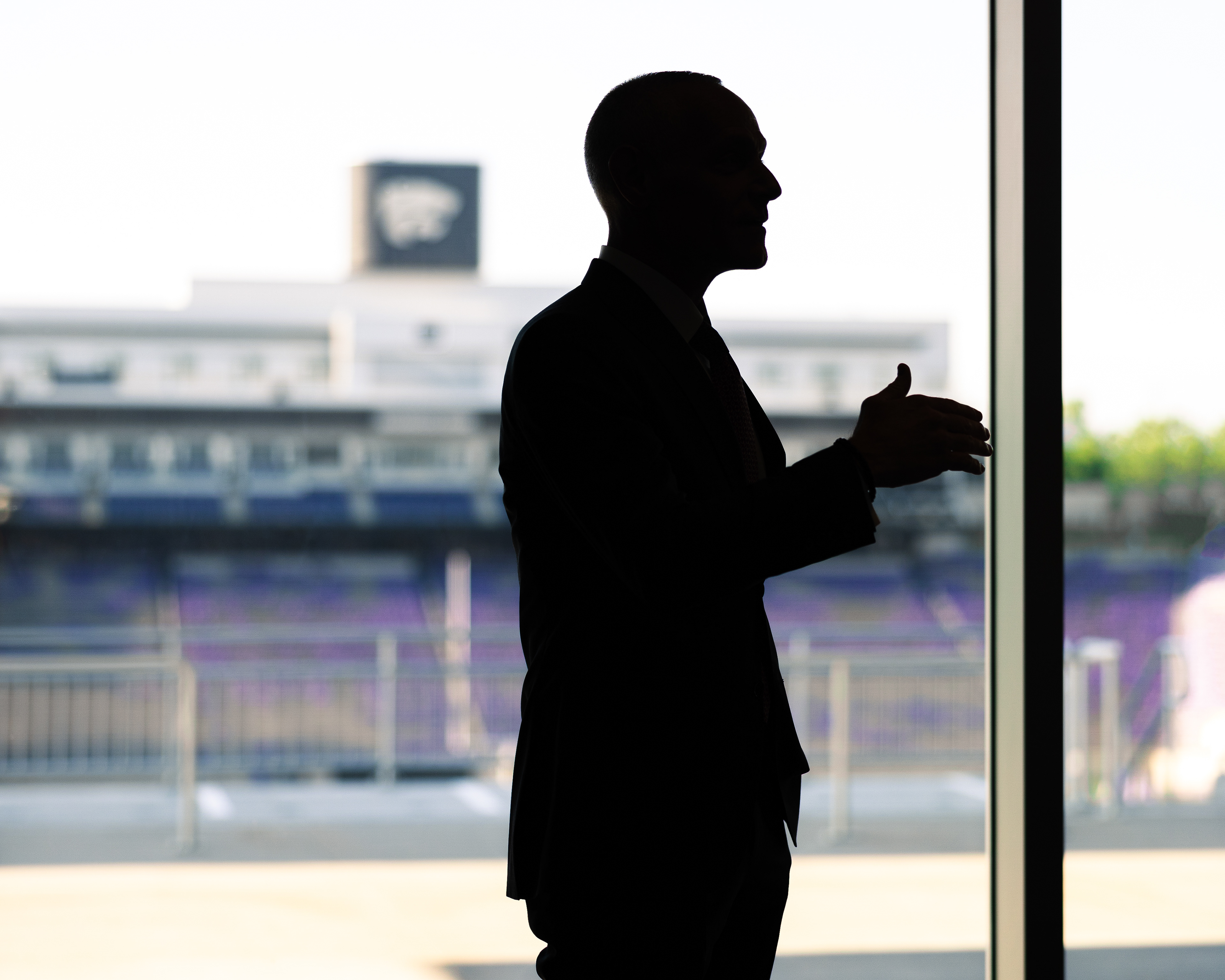 Big 12 Commissioner Brett Yormark speaks to Kansas State Athletic Director Gene Taylor