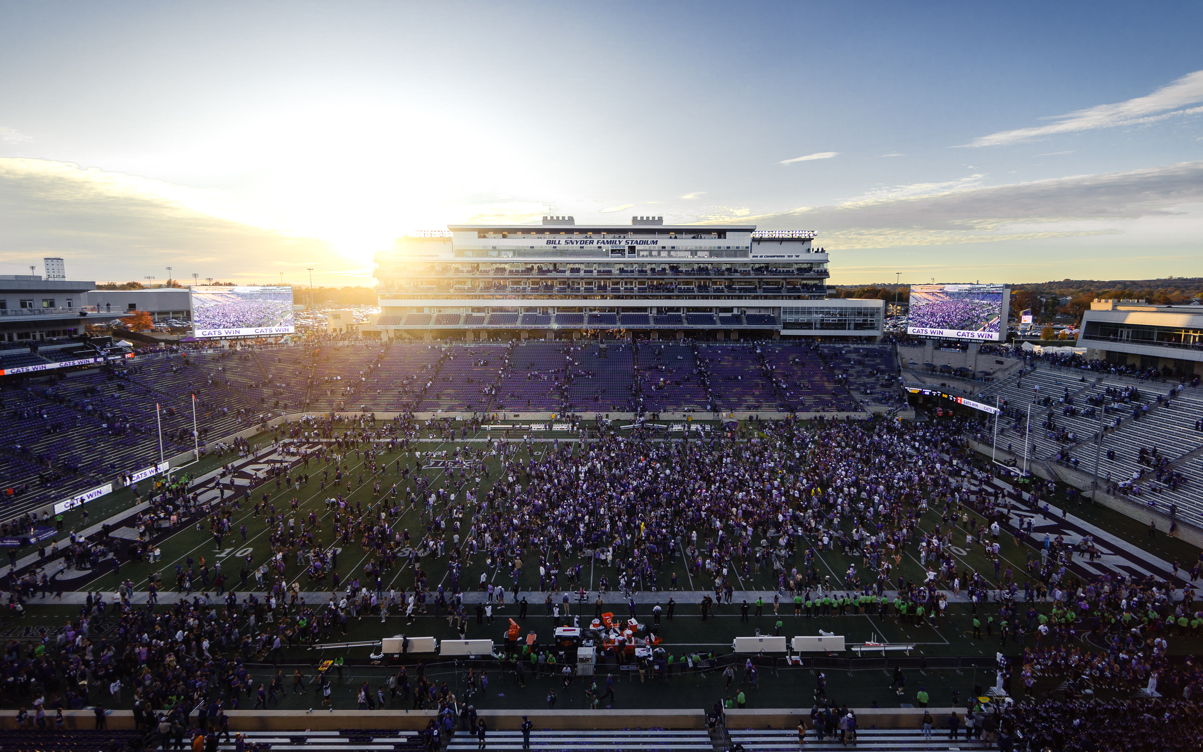 Kansas State fans storm the field following a 48-0 blowout win over Oklahoma State