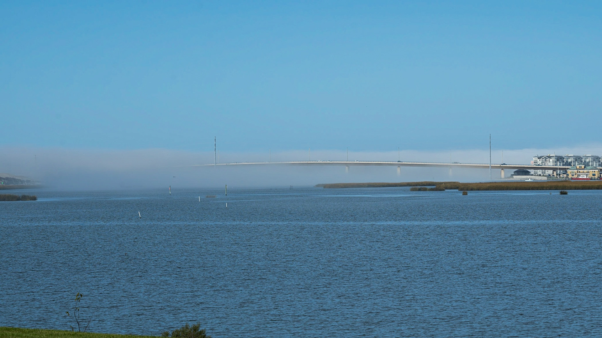 weather front enveloping a bridge, Virgina Beach.