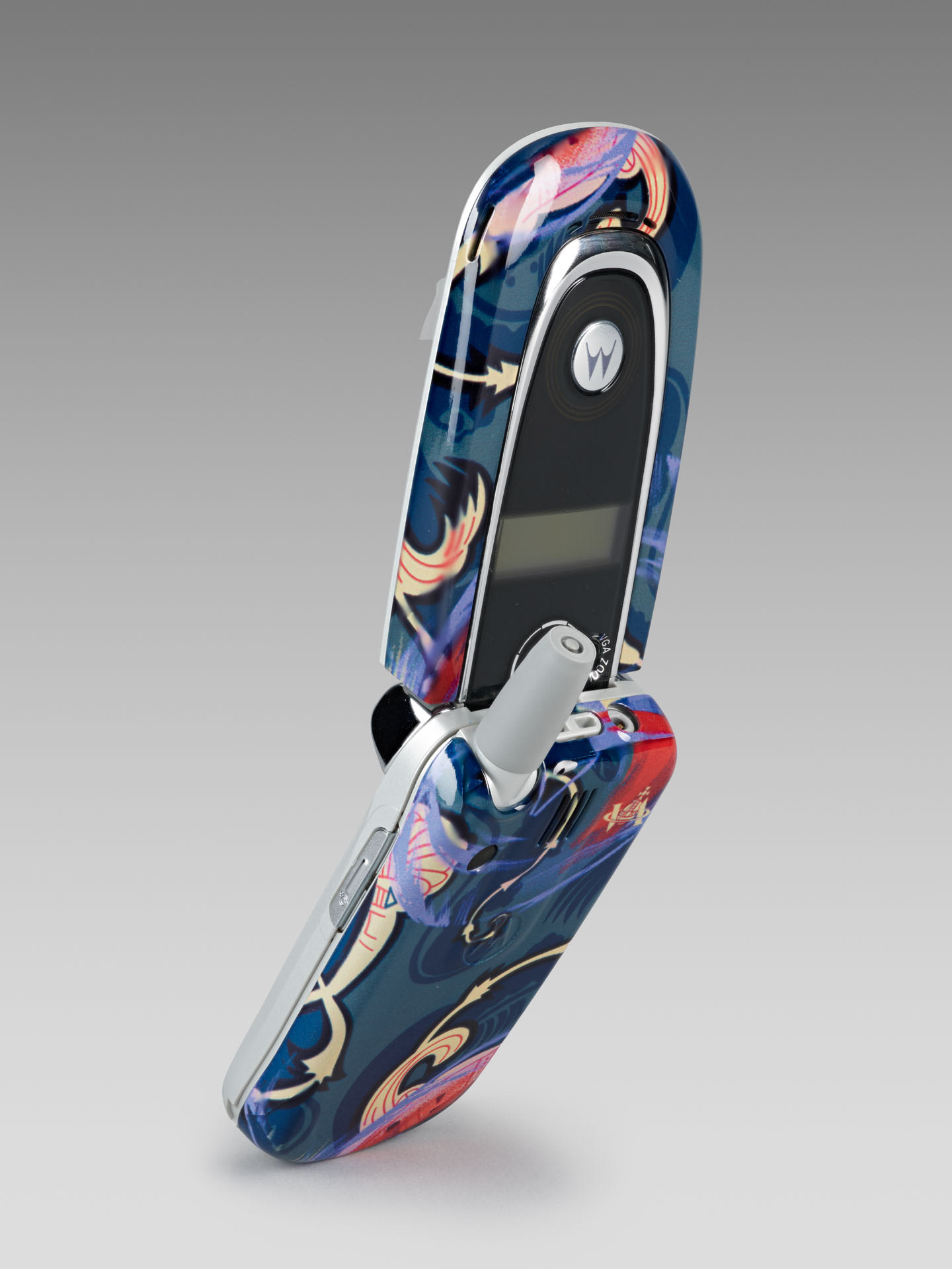 Motorola & Vivienne Westwood. 'Clamshell' phone with colourful cover, produced to coincide with the V&A Westwood retrospective in 2004 © Victoria and Albert Museum, London