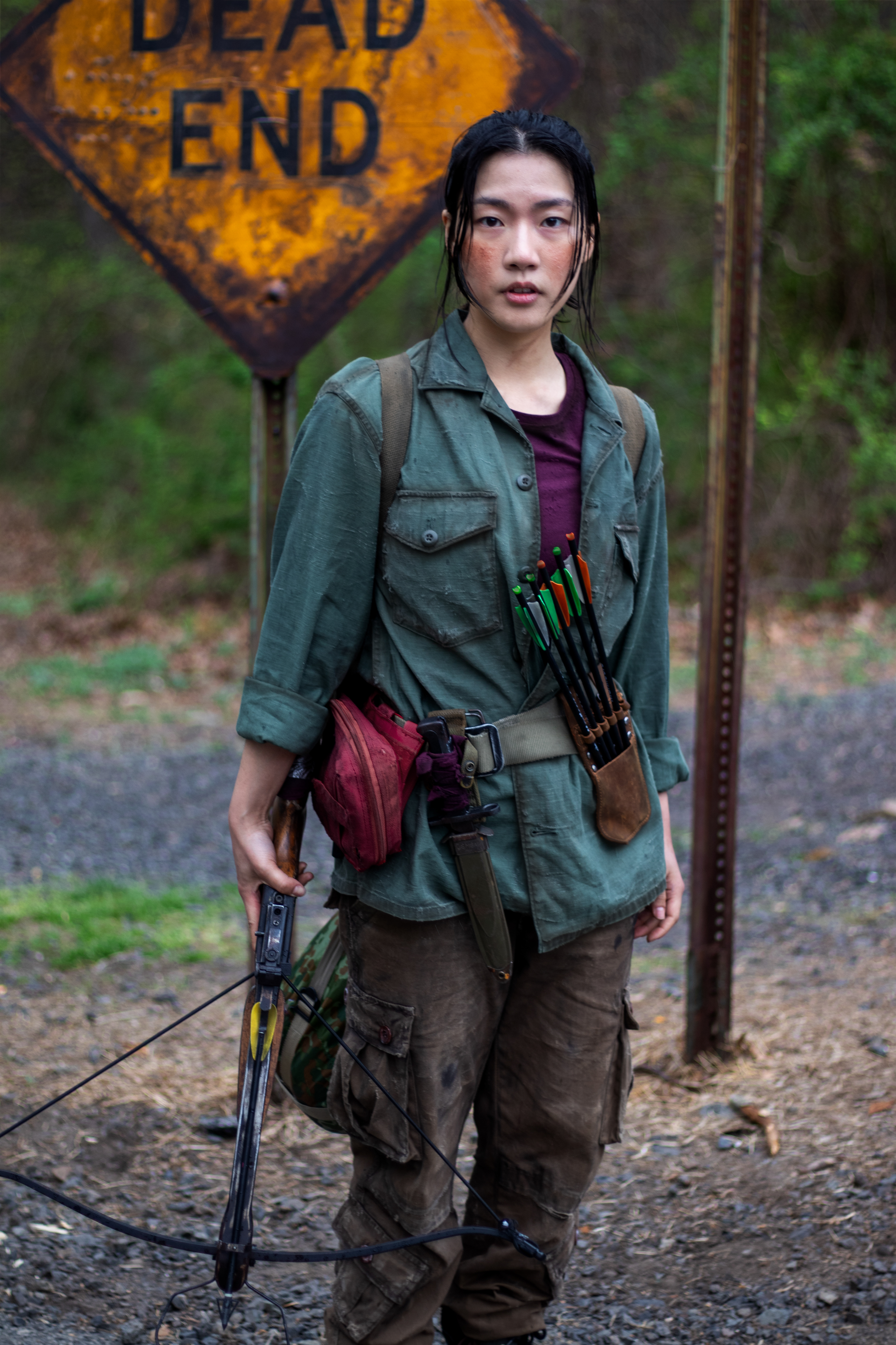 Hanna, the young but hardened survivor and sister to Mitch | Weathered clothing and survival gear