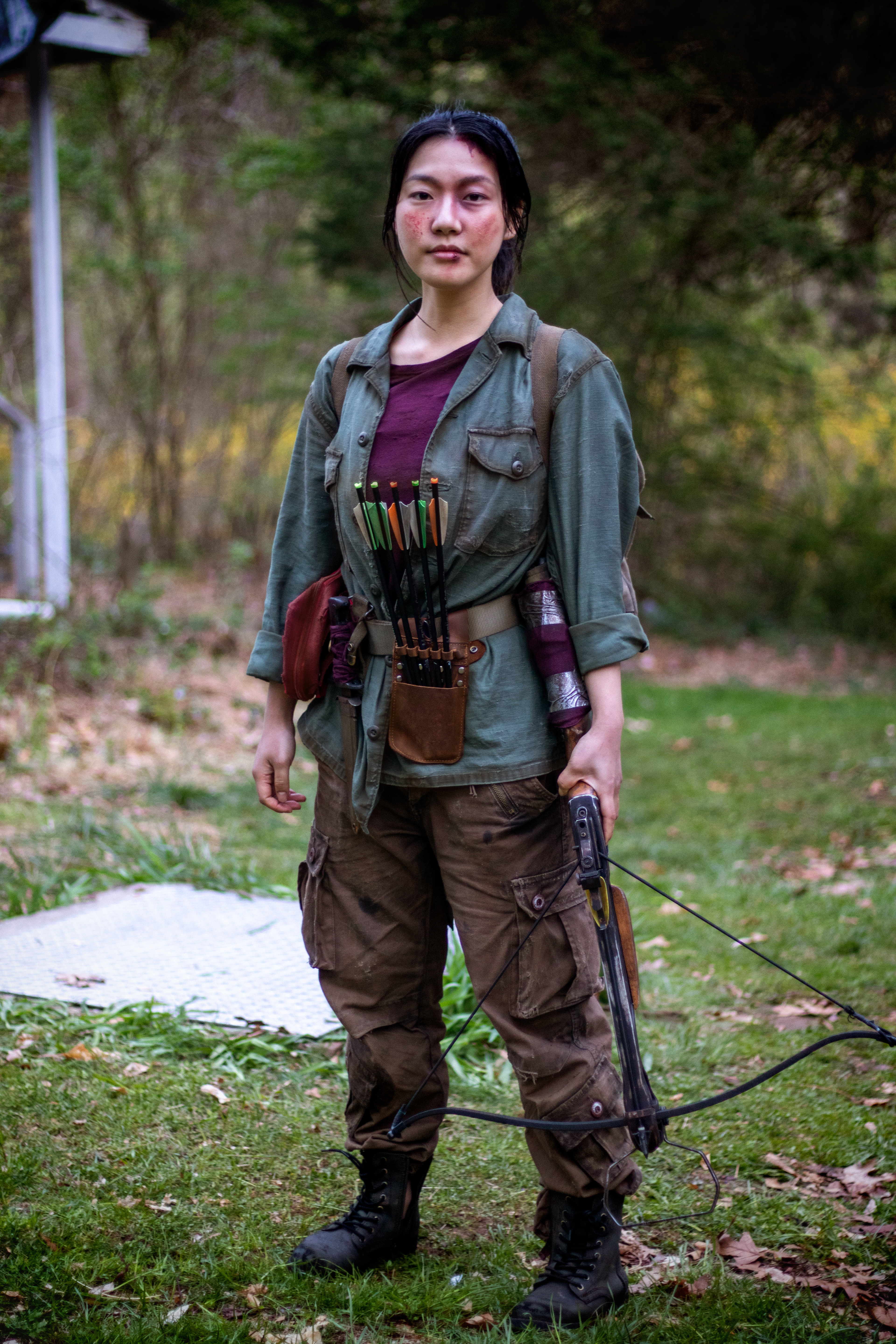 Hanna, the young but hardened survivor and sister to Mitch | Weathered clothing and survival gear