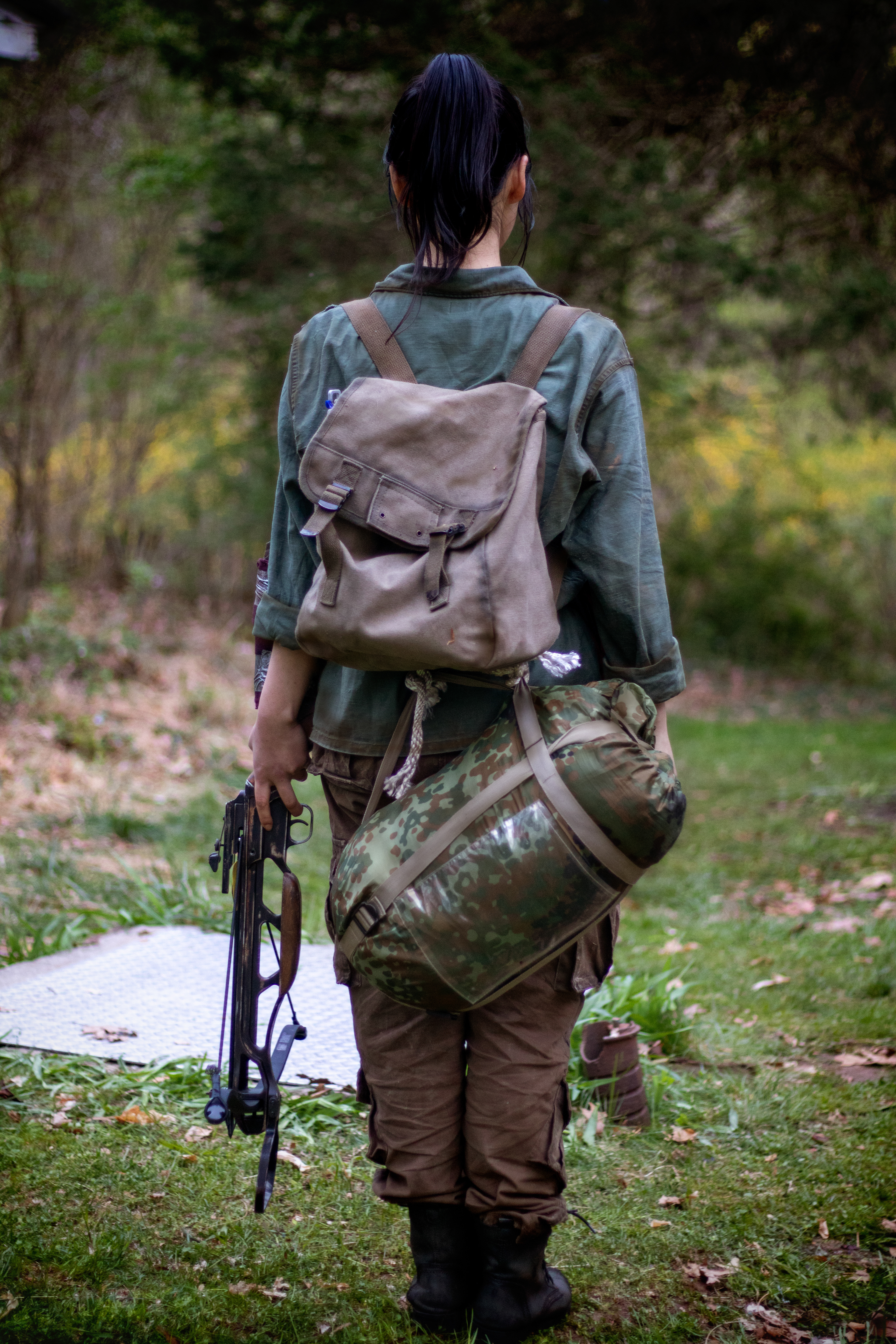 Hanna, the young but hardened survivor and sister to Mitch | Weathered clothing and survival gear