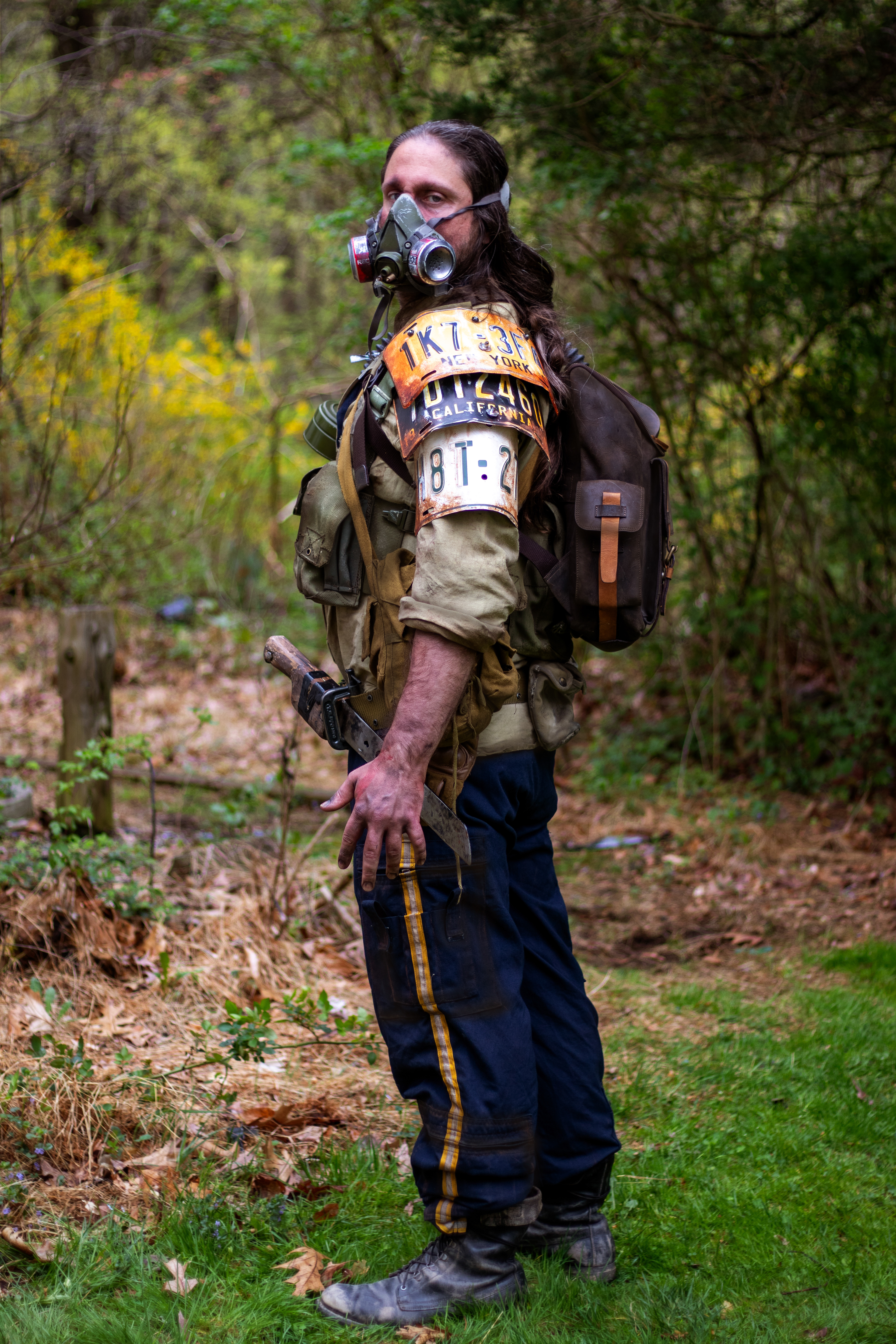 The Man, a veteran wasteland survivalist | Custom license-plate shoulder armor, weathered clothing, and miscellaneous survival and combat gear.