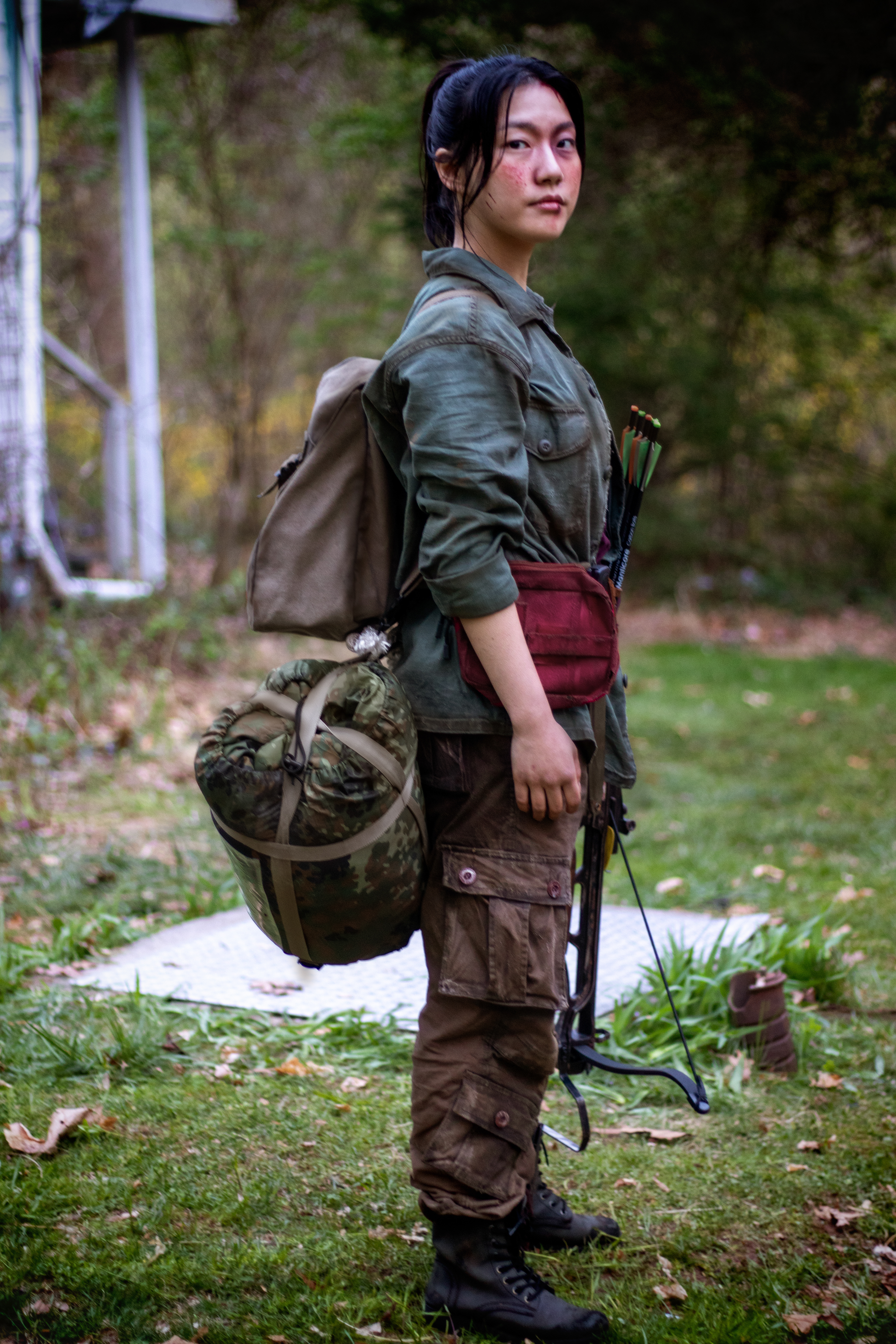 Hanna, the young but hardened survivor and sister to Mitch | Weathered clothing and survival gear