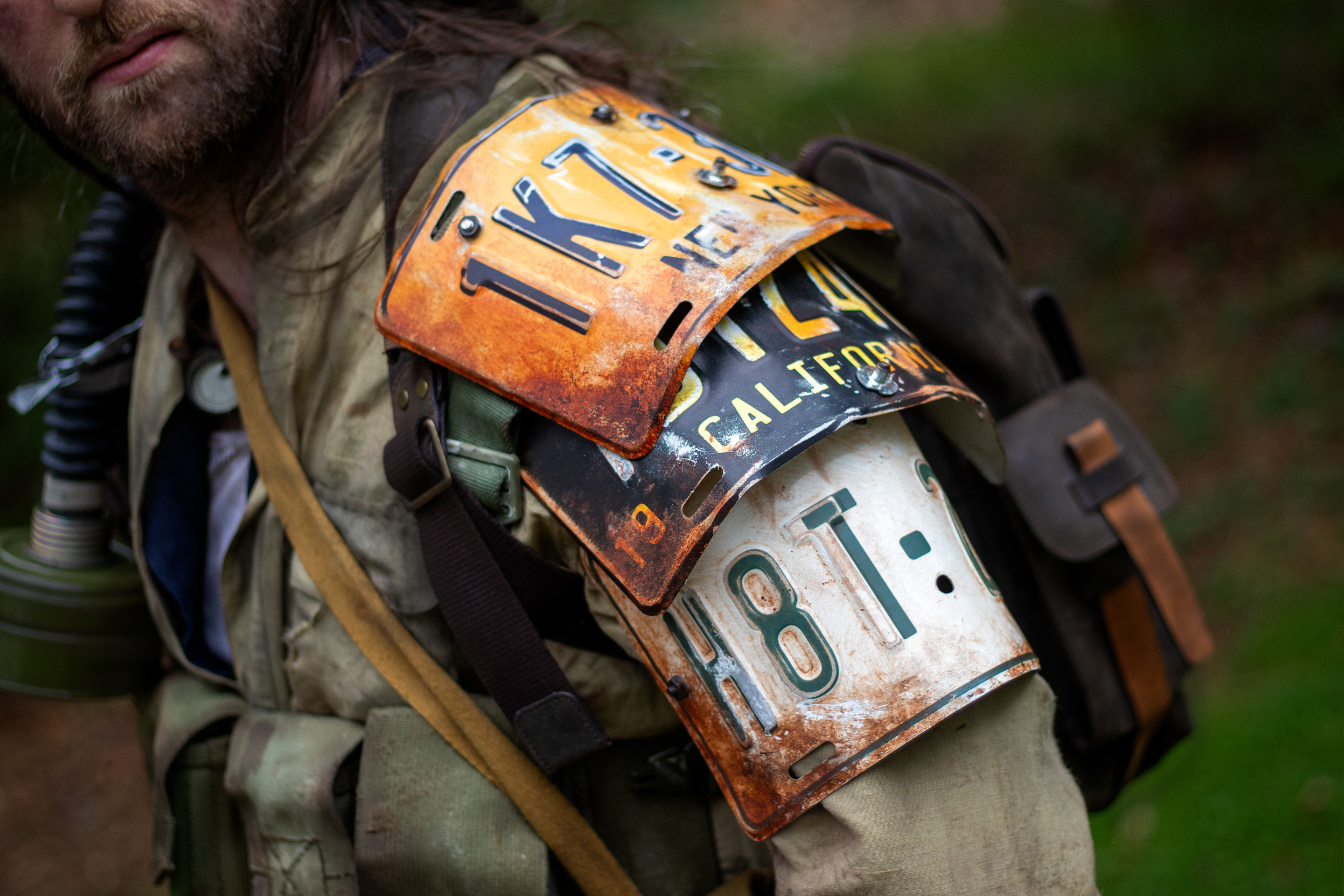 The Man, a veteran wasteland survivalist | Custom license-plate shoulder armor, weathered clothing, and miscellaneous survival and combat gear.