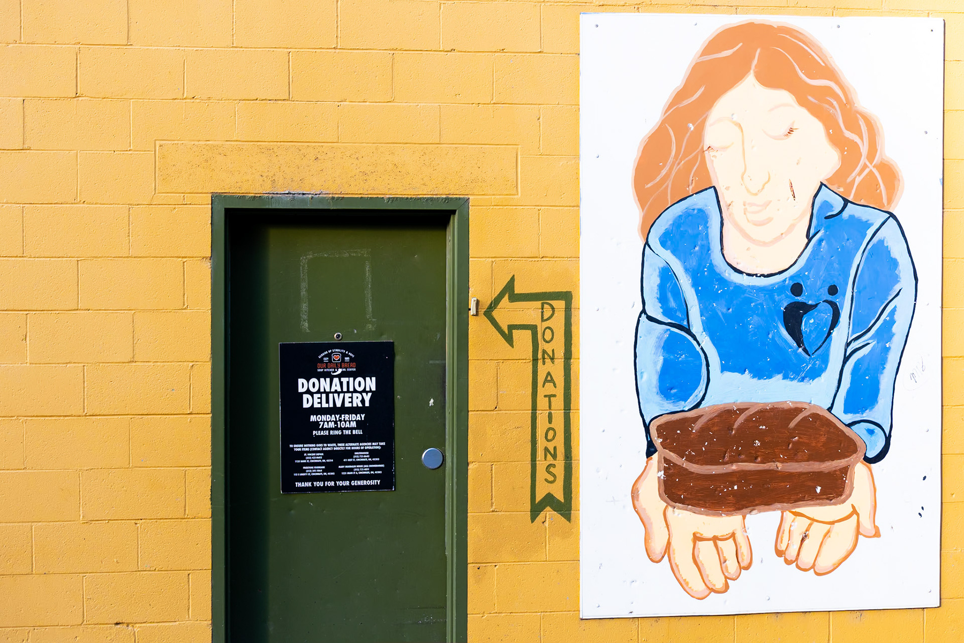 Hidden at the back of the bright yellow building, you can find Our Daily Bread's back door, which serves as the drop-off location for all their donated or rescued food. This door is accompanied by a painted mural and a doorbell, which is used to notify staff that a donation has been delivered! With 70% of Our Daily Bread's guests identifying as homeless, a hot meal is the ideal place to start, and donations are the key to it all.