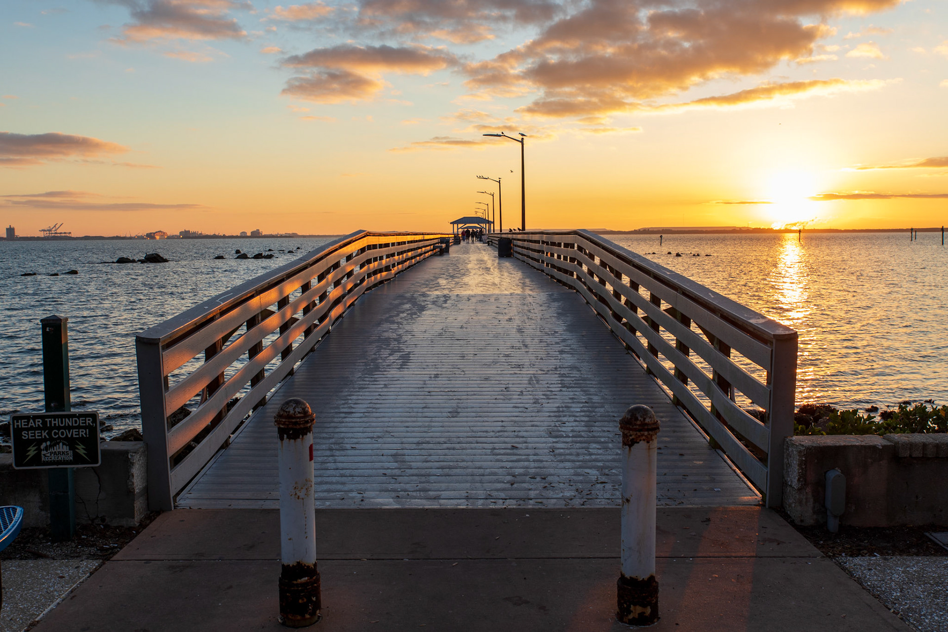 A view of the Ballast Point Park fishing pier at sunrise.