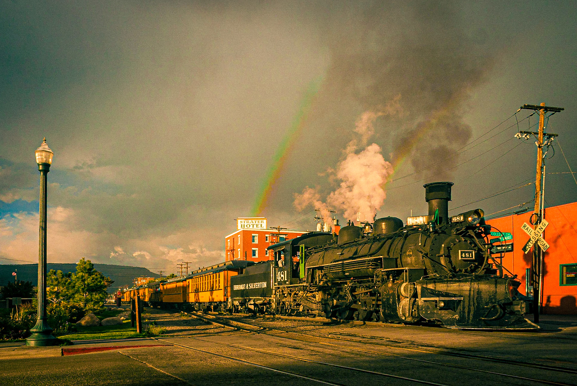 February 15, 2021The Durango &amp; Silverton narrow gauge railroad steam pulling into Durango, CO. just before an afternoon rainstorm. Durango, Colorado was founded by the Denver &amp; Rio Grande Railway in 1879. The railroad arrived in Durango on August 5, 1881 and construction on the line to Silverton began in the fall of the same year. By July of 1882, the tracks to Silverton were completed, and the train began hauling both freight and passengers. The historic train has been in continuous operation between Durango and Silverton since 1882, carrying passengers behind vintage steam locomotives and rolling stock indigenous to the line.
